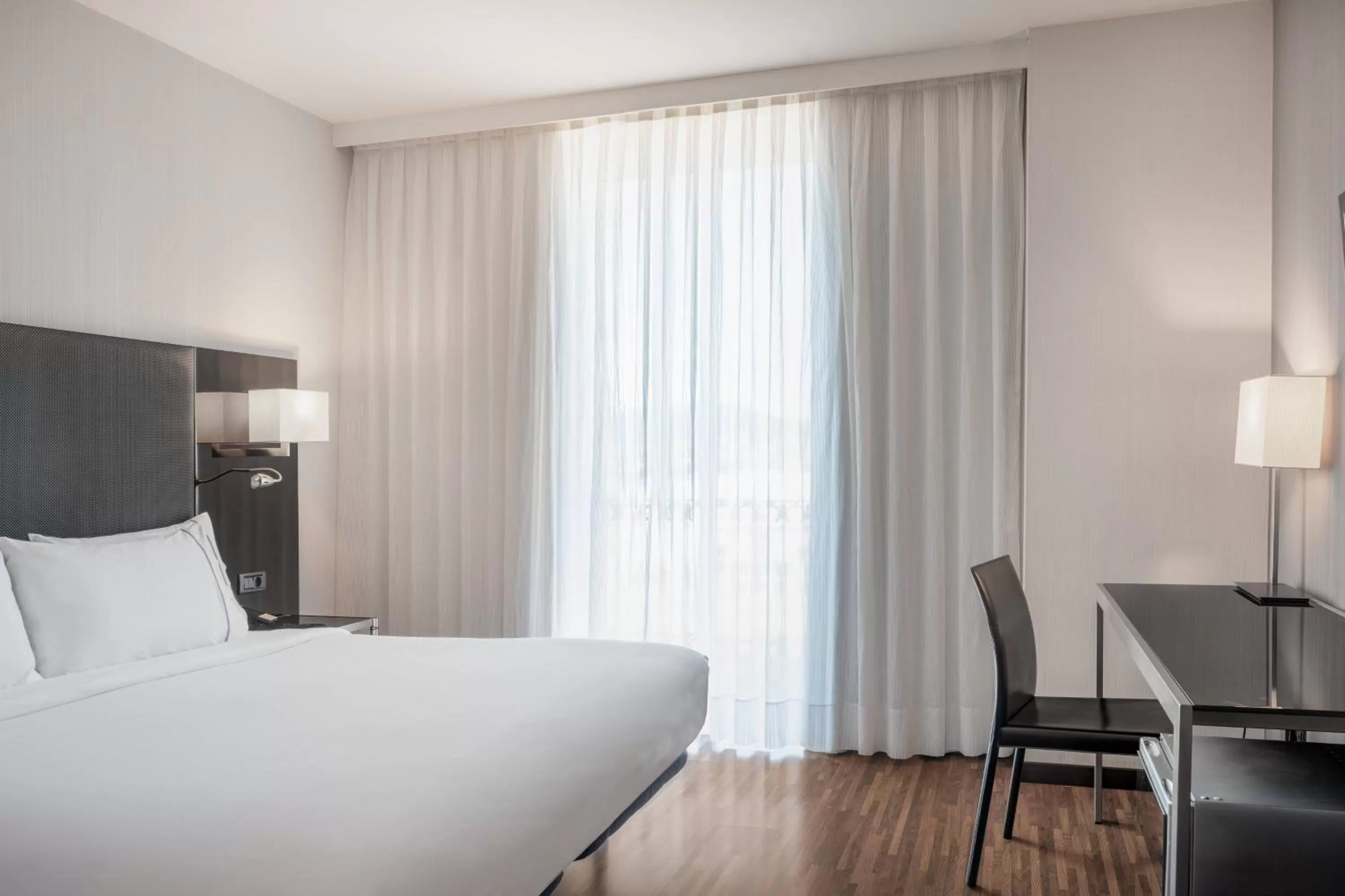 Photo of the whole room, Bed in AC Hotel Palacio Universal by Marriott