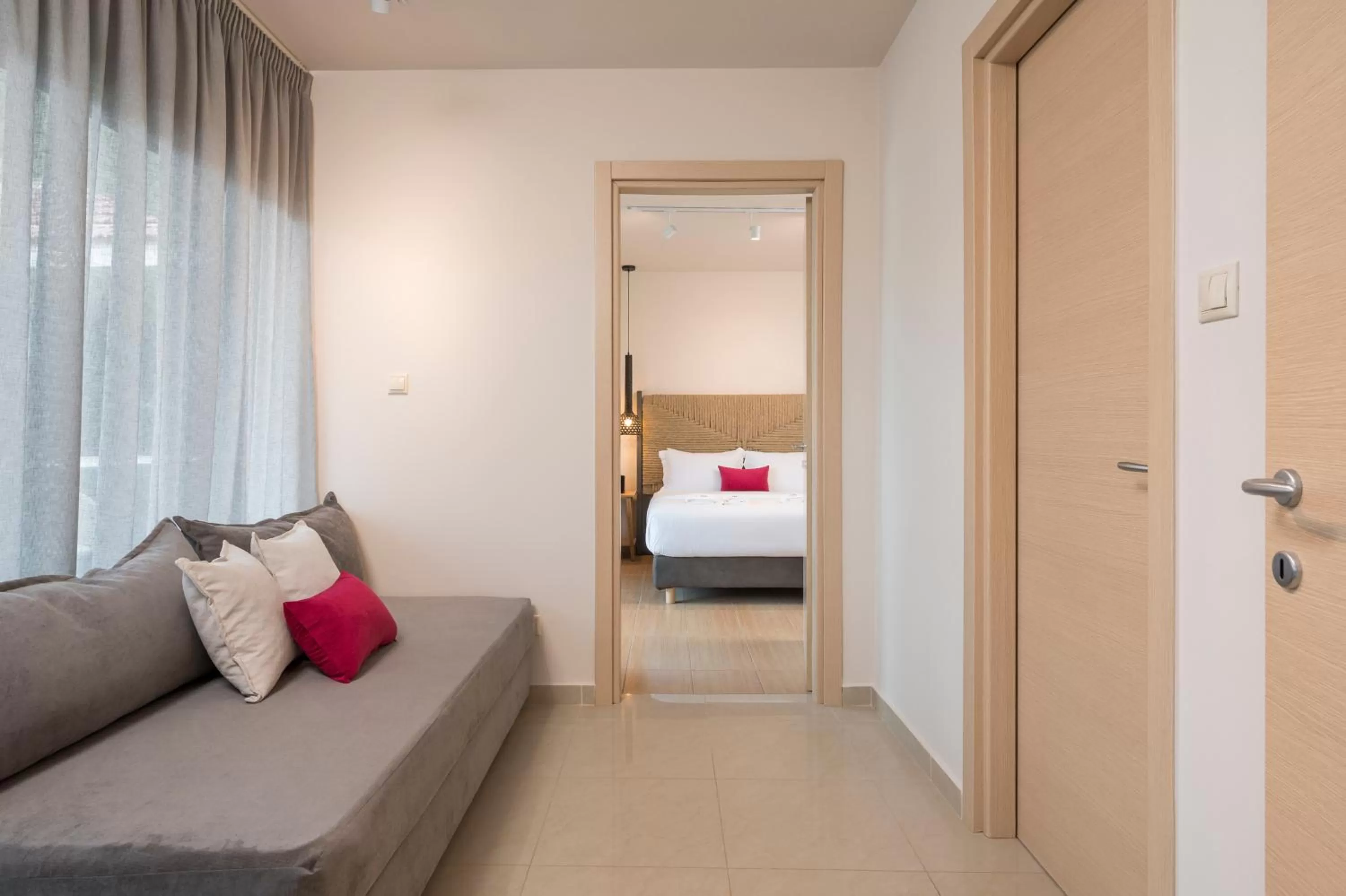 Seating area, Bed in Trianon Luxury Apartments & Suites