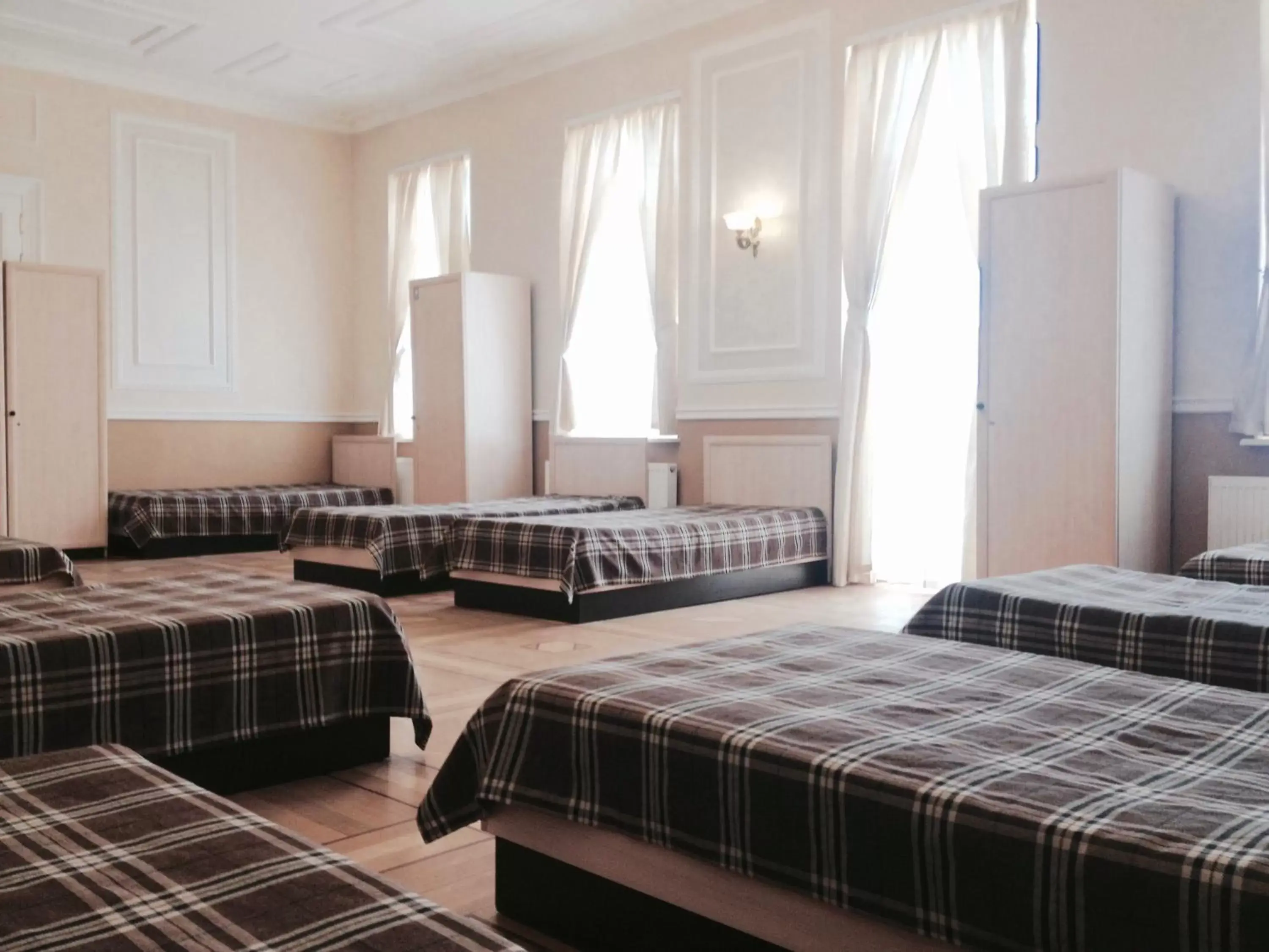 Family room with 10 single beds in Mini-Hotel Under The Roof Family room with 10 single beds in Mini-Hotel Under The Roof