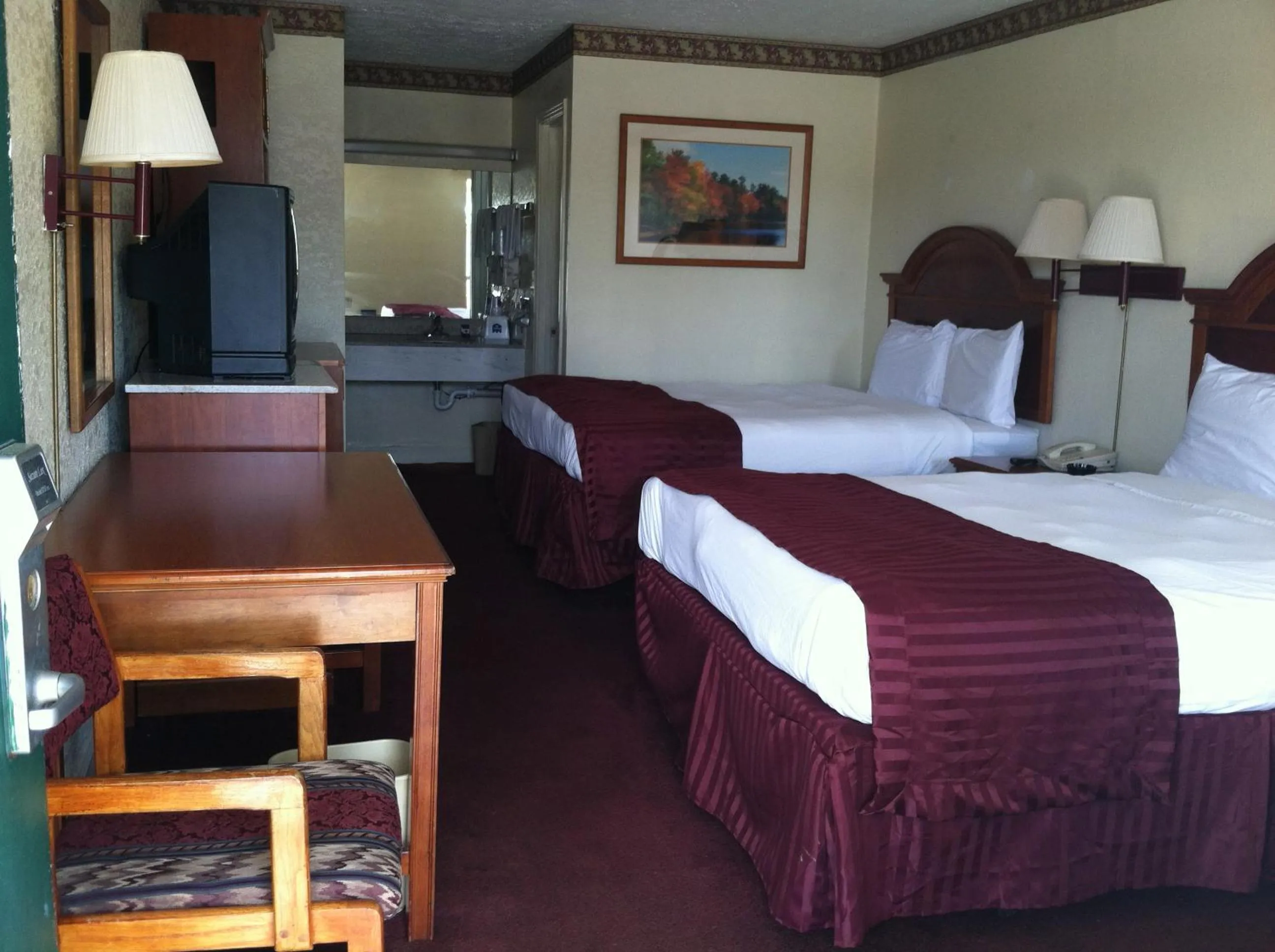 Bed in Knights Inn Hurricane Mills