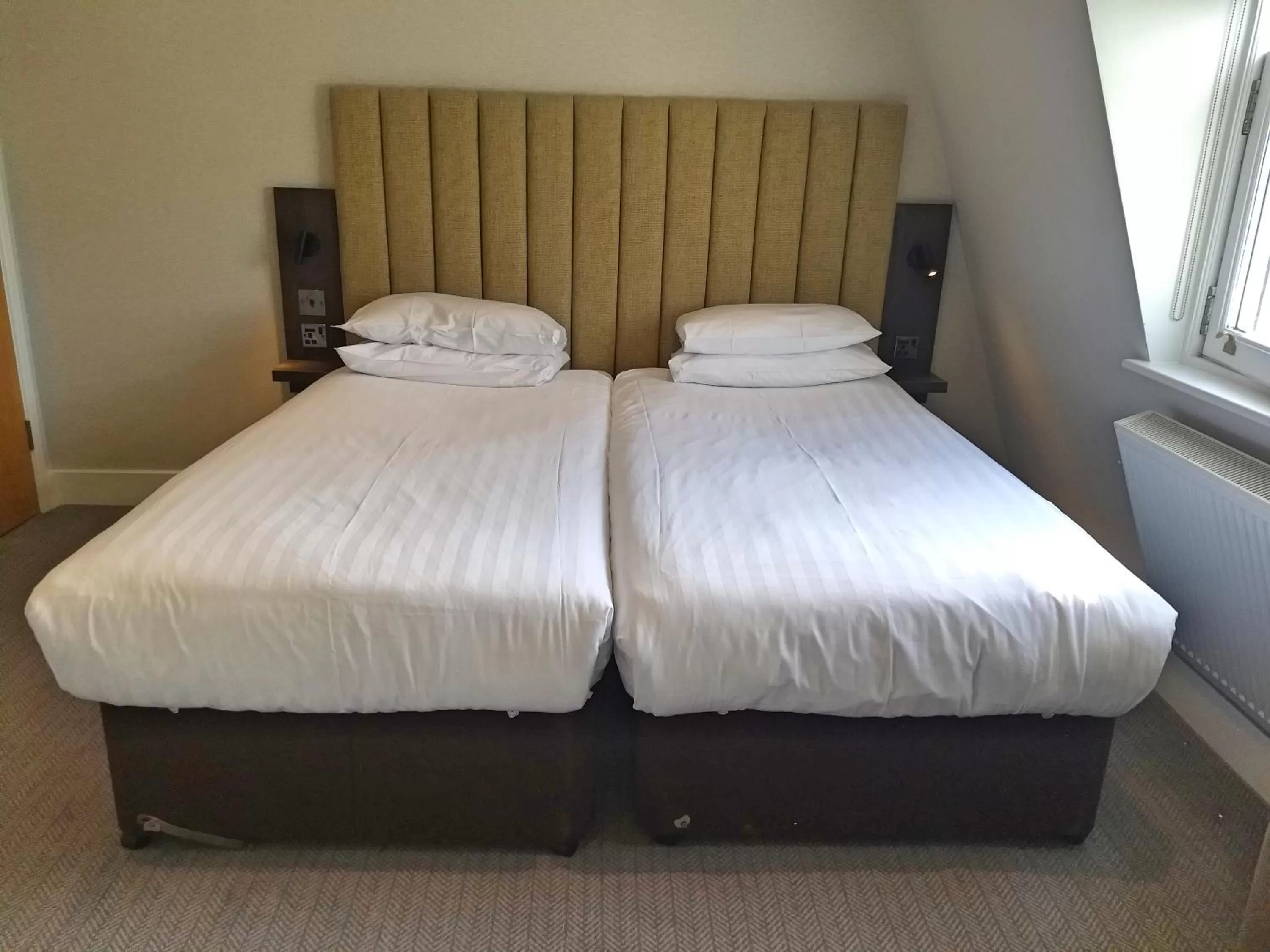 Bed in Garden Court Hotel