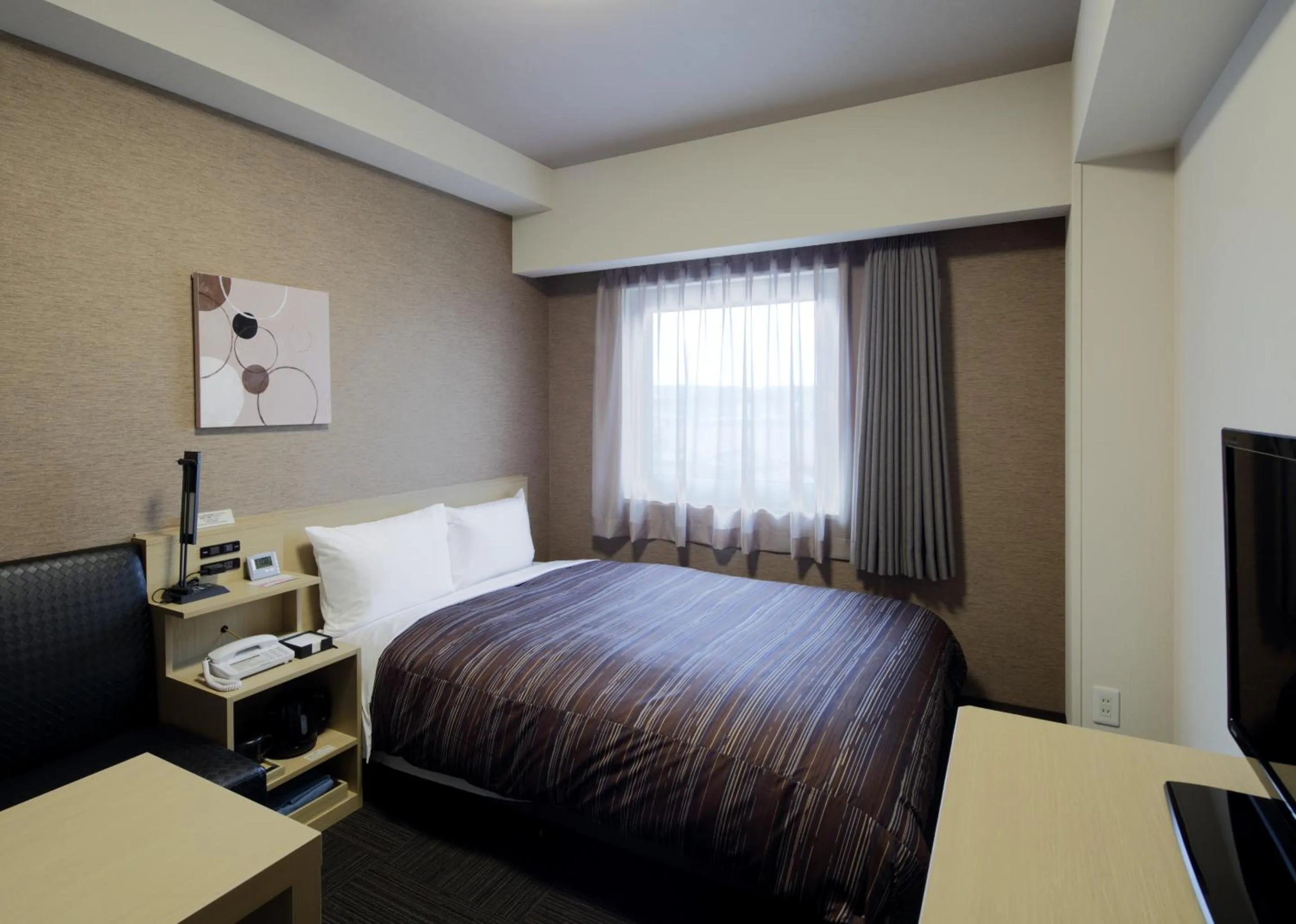 Bed in Hotel Route-Inn Sendai Higashi