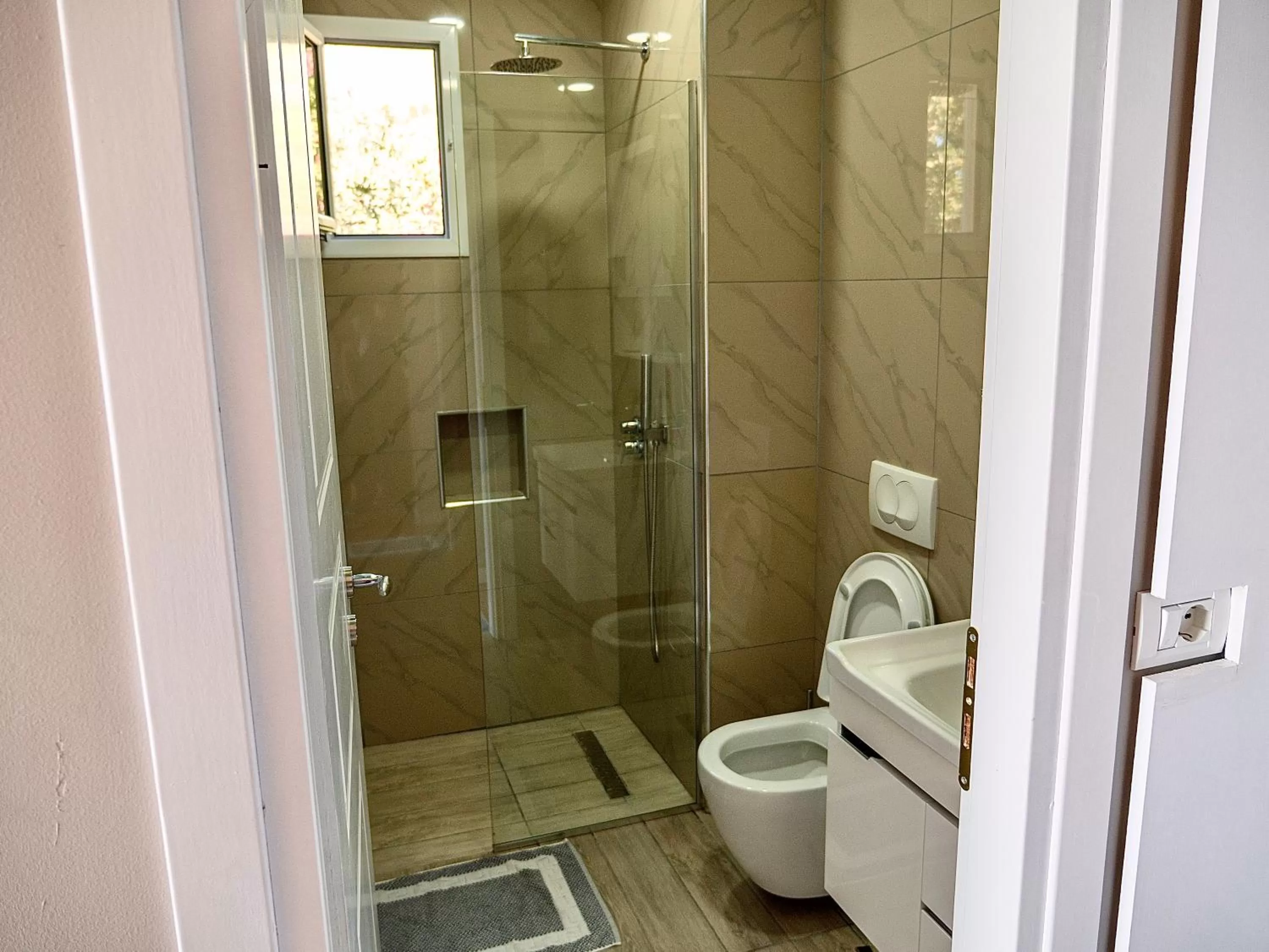 Bathroom in Aphrodite Garden Rooms & Apartment
