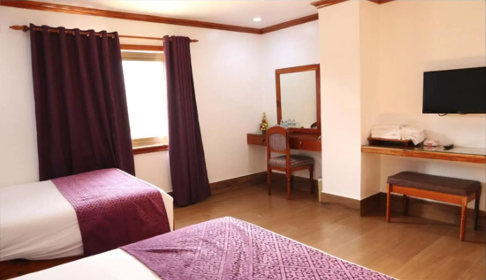 Photo of the whole room, TV/Entertainment Center in CLN Boutique Hotel