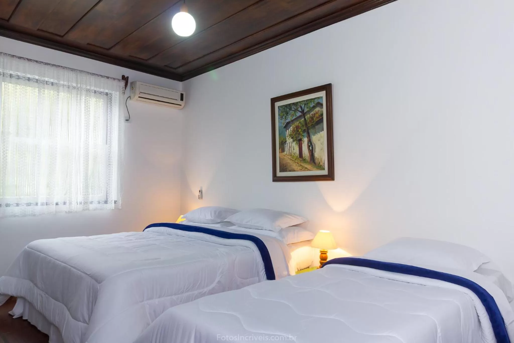 Bed in Pousada Aconchego