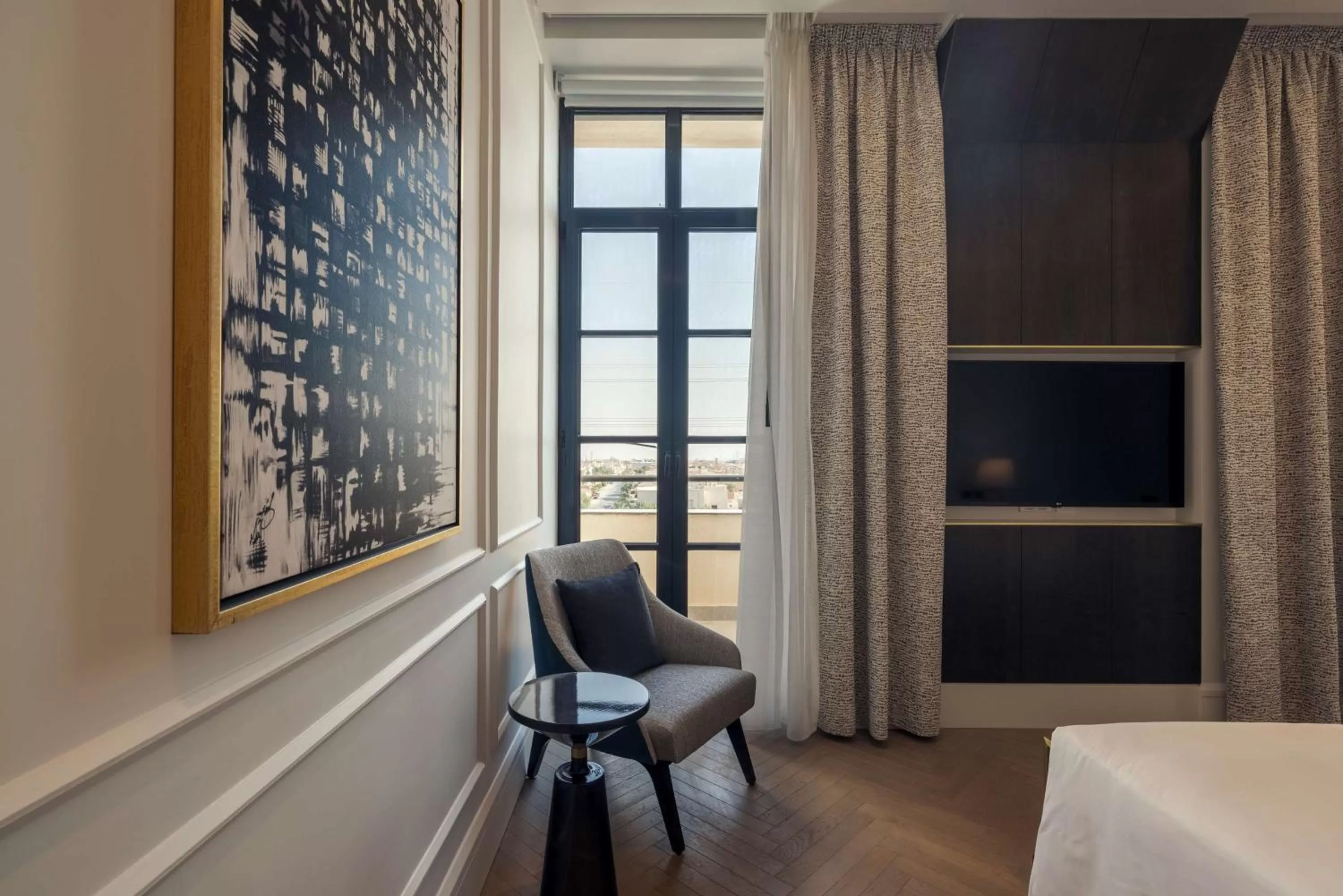 Photo of the whole room, Bed in Mansard Riyadh, a Radisson Collection Hotel