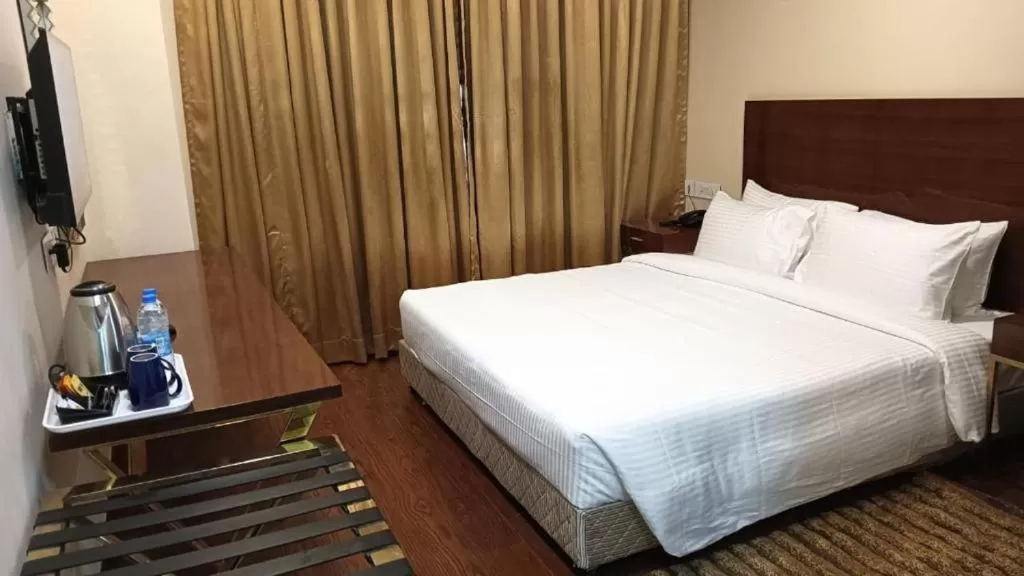 Bed in Layalee Grande Hotel Chennai