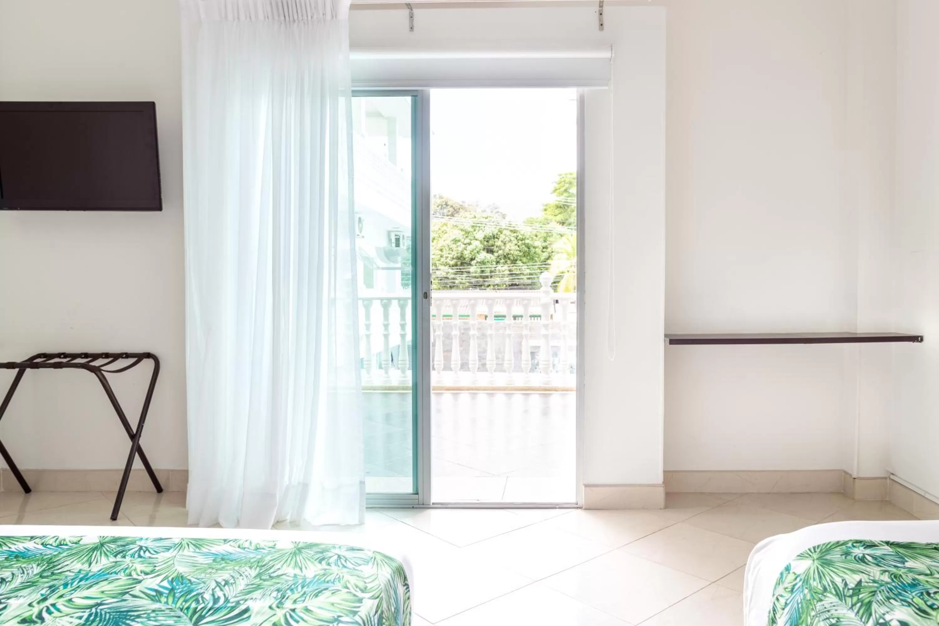 TV and multimedia, Bed in Hotel Manantial Melgar