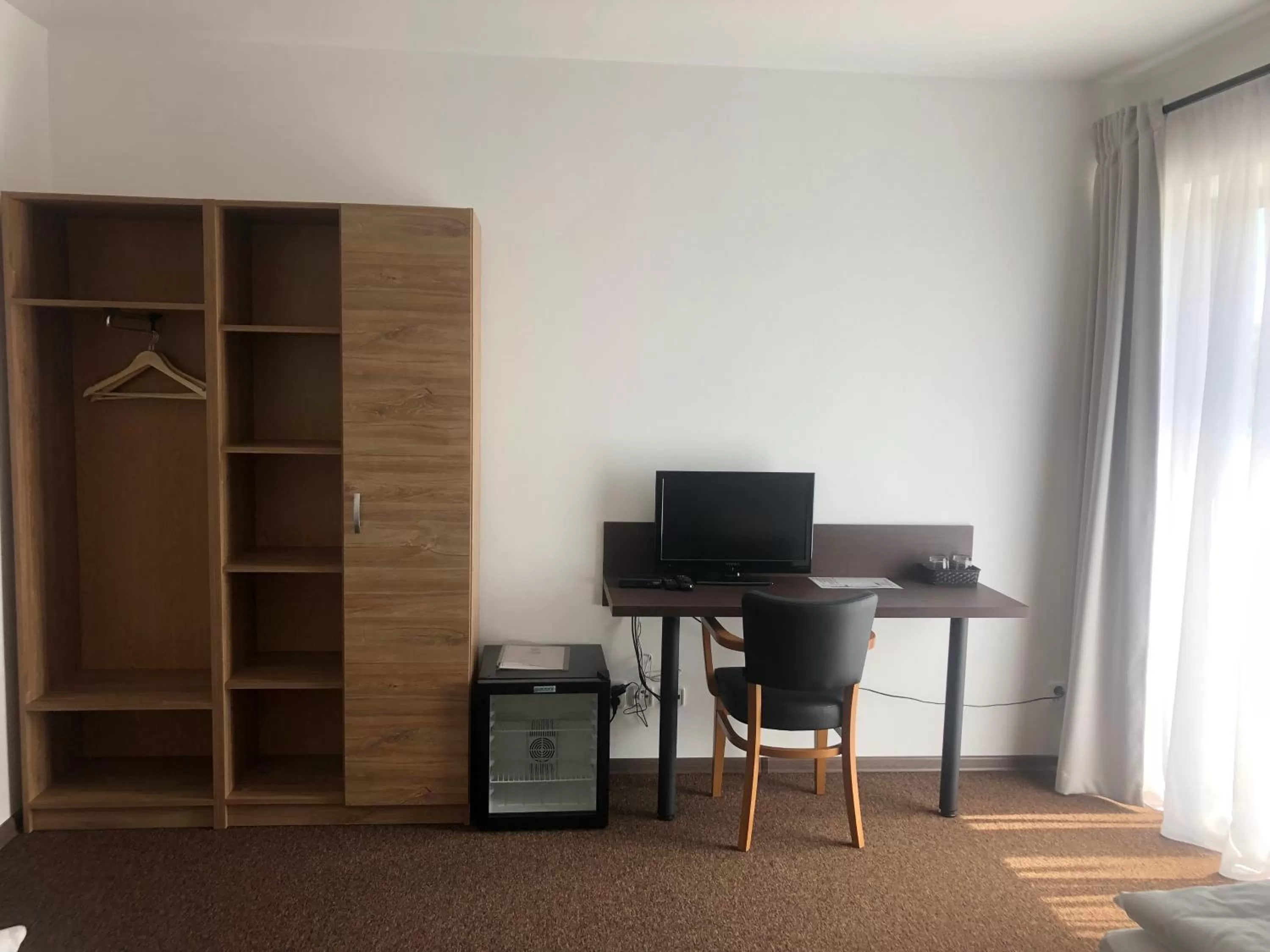 Communal lounge/ TV room, TV/Entertainment Center in Hotel Sport Mlada Boleslav