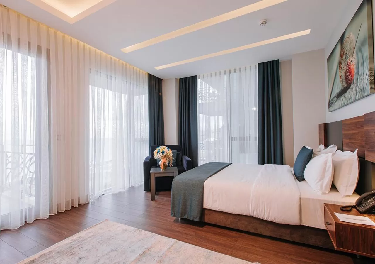 Bed in Peerless Villas Hotel