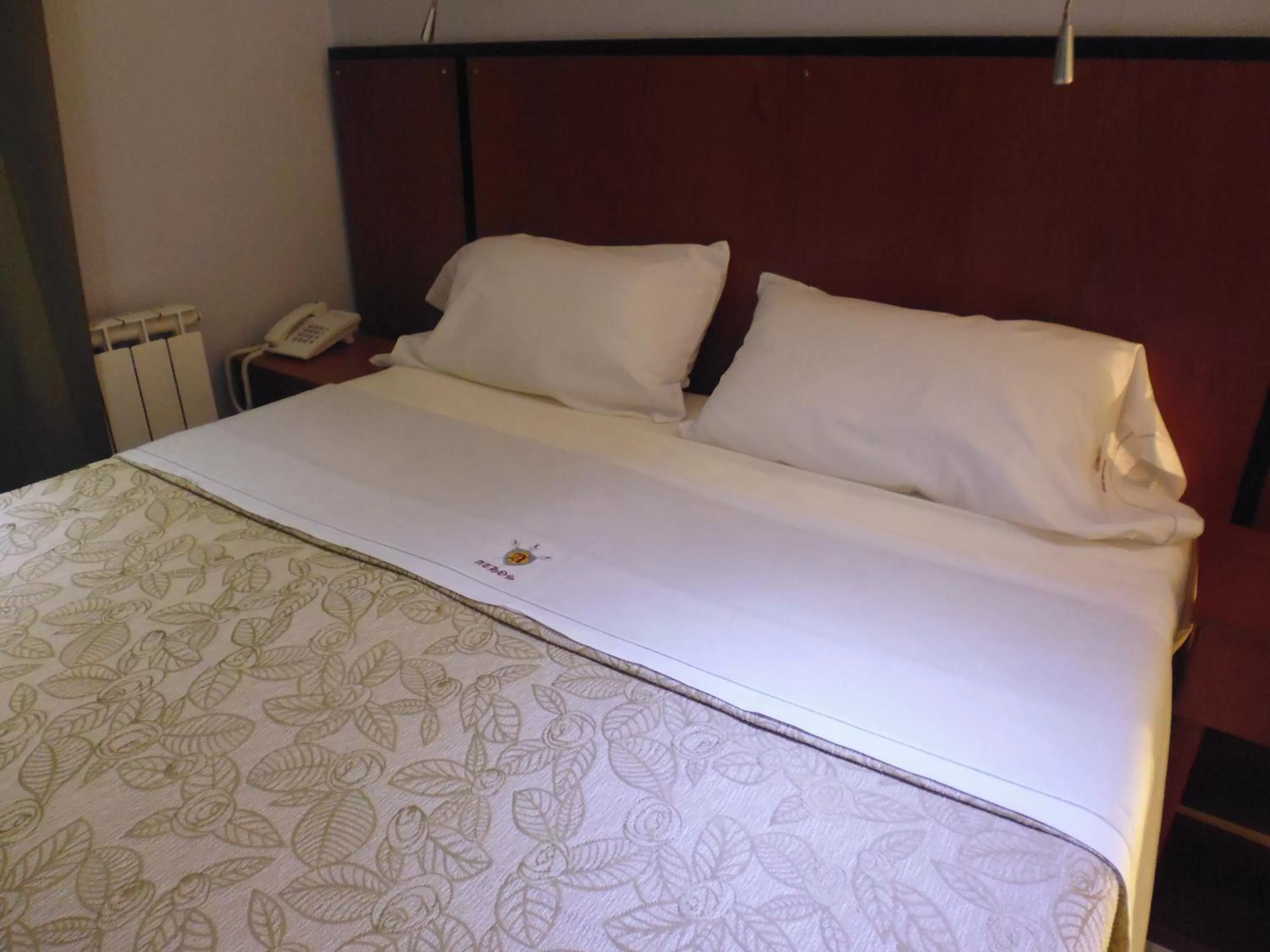 Bed in Hotel Athos