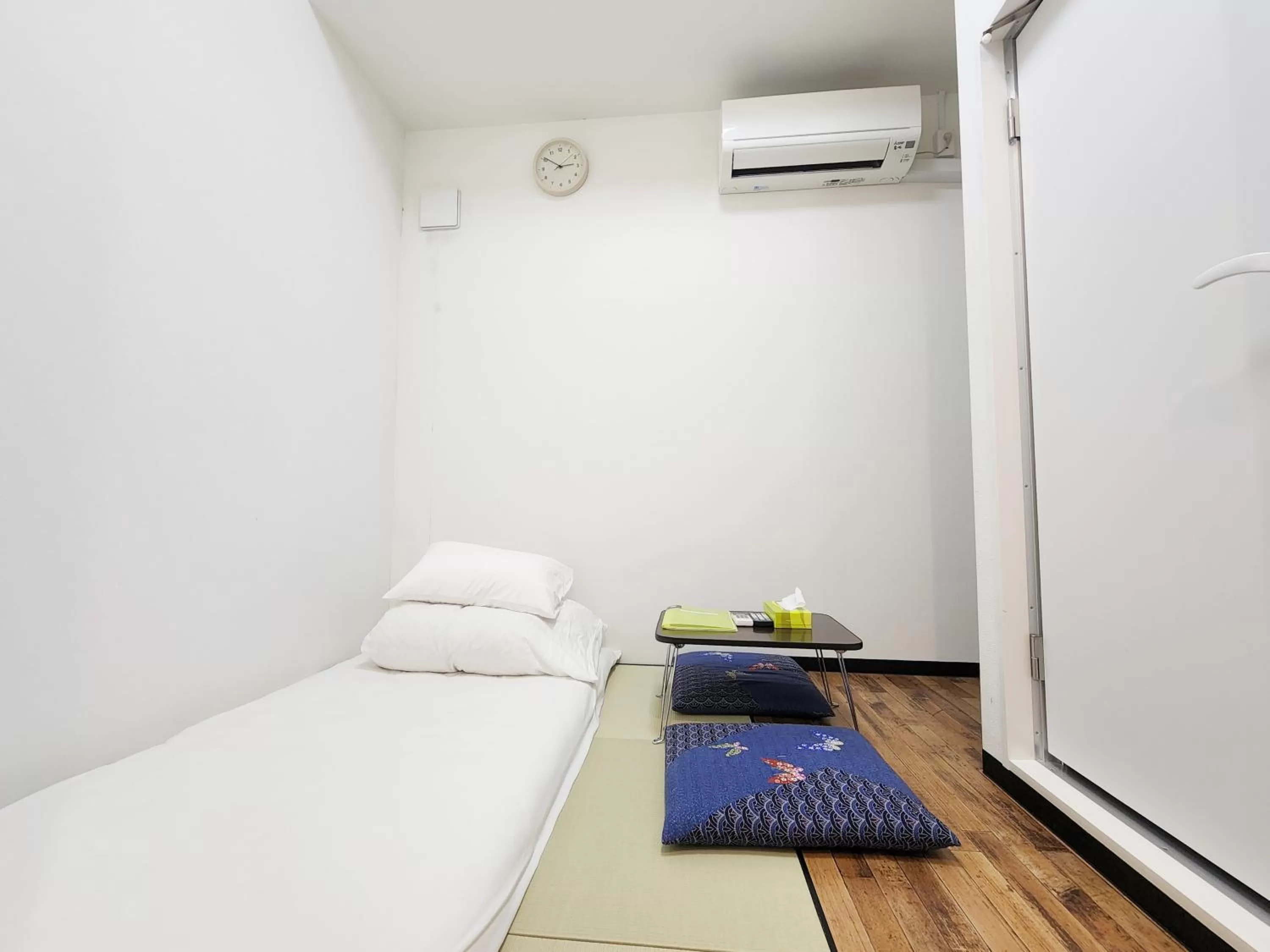 Bed in KYU KYU HOTEL