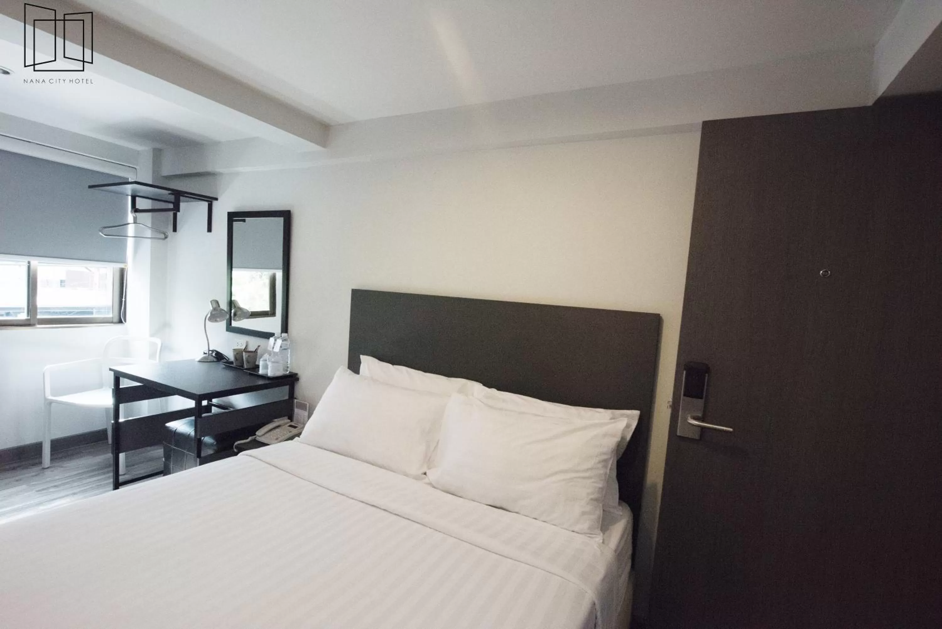 Bed in Nana City Hotel