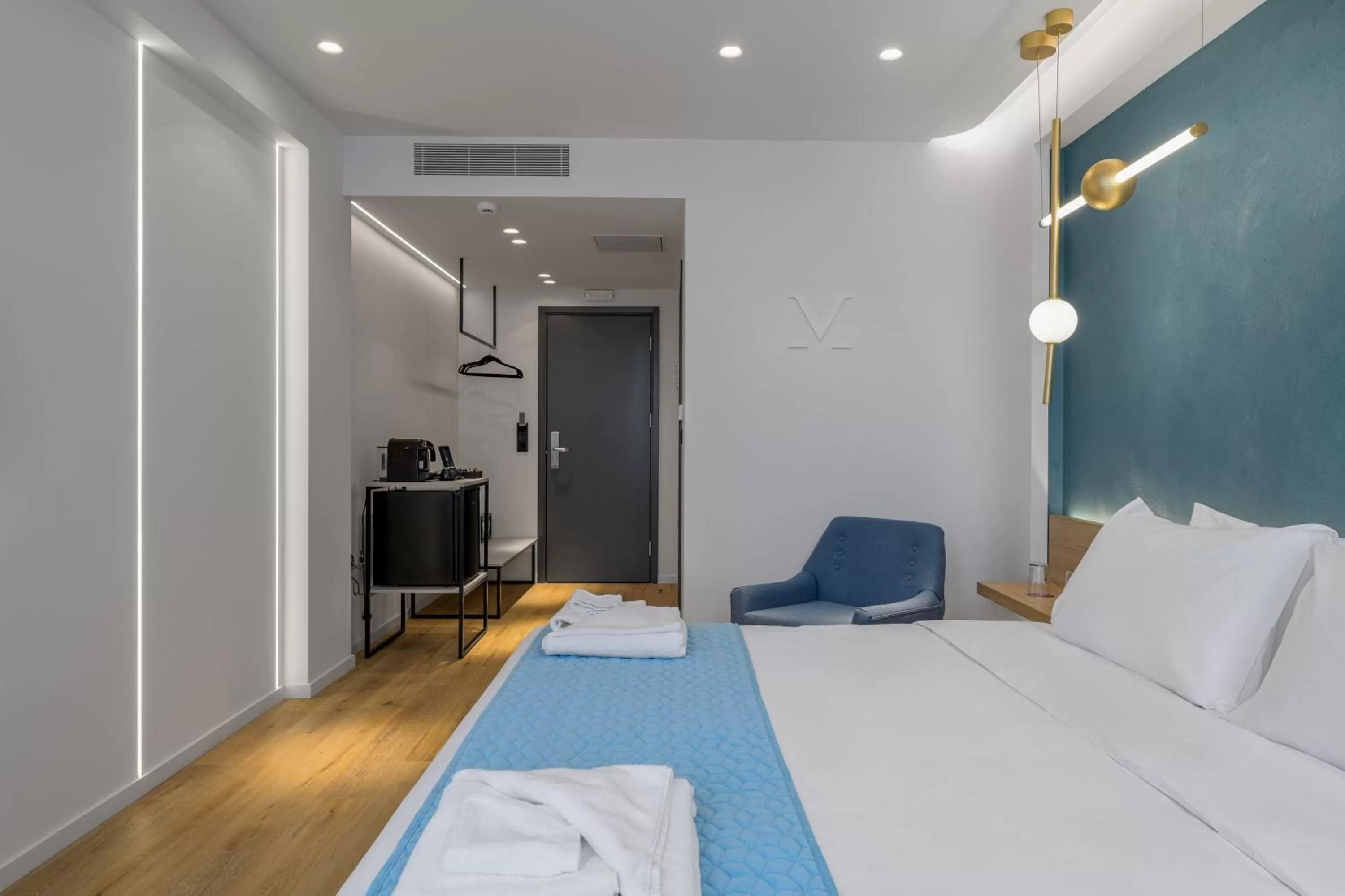 Bed in Acropolis Magenta Luxury Suites