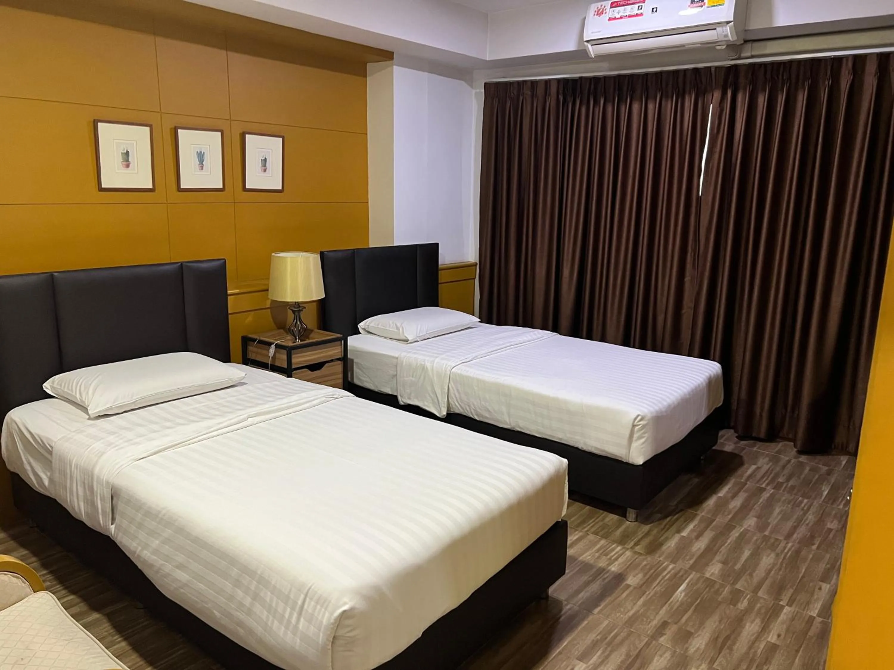 Bed in Mall Suites Hotel
