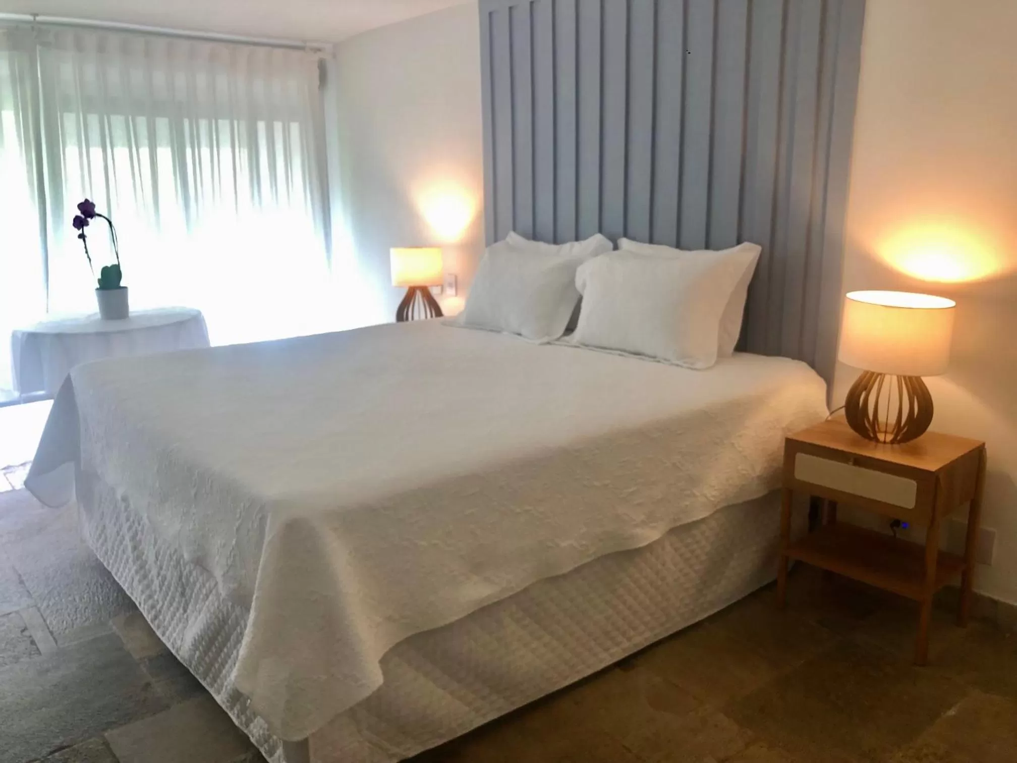 Bed in Guest House Guarujá