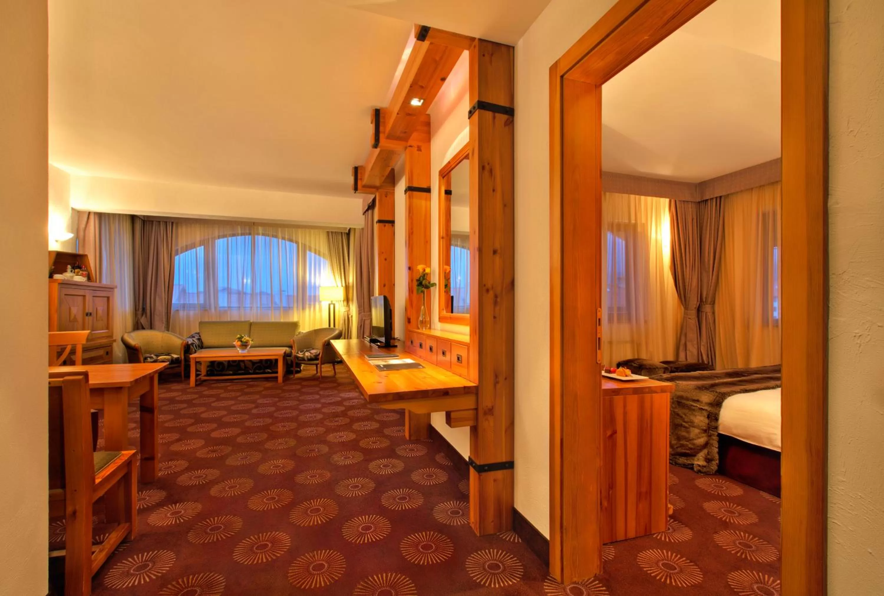 Living room, Bed in Kempinski Hotel Grand Arena Bansko