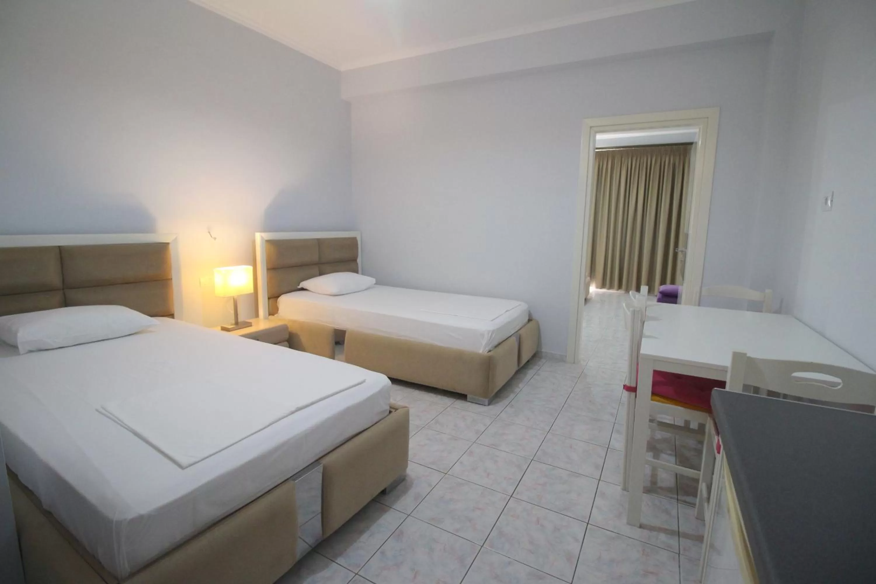 Bed in Murati Suites Sarandë