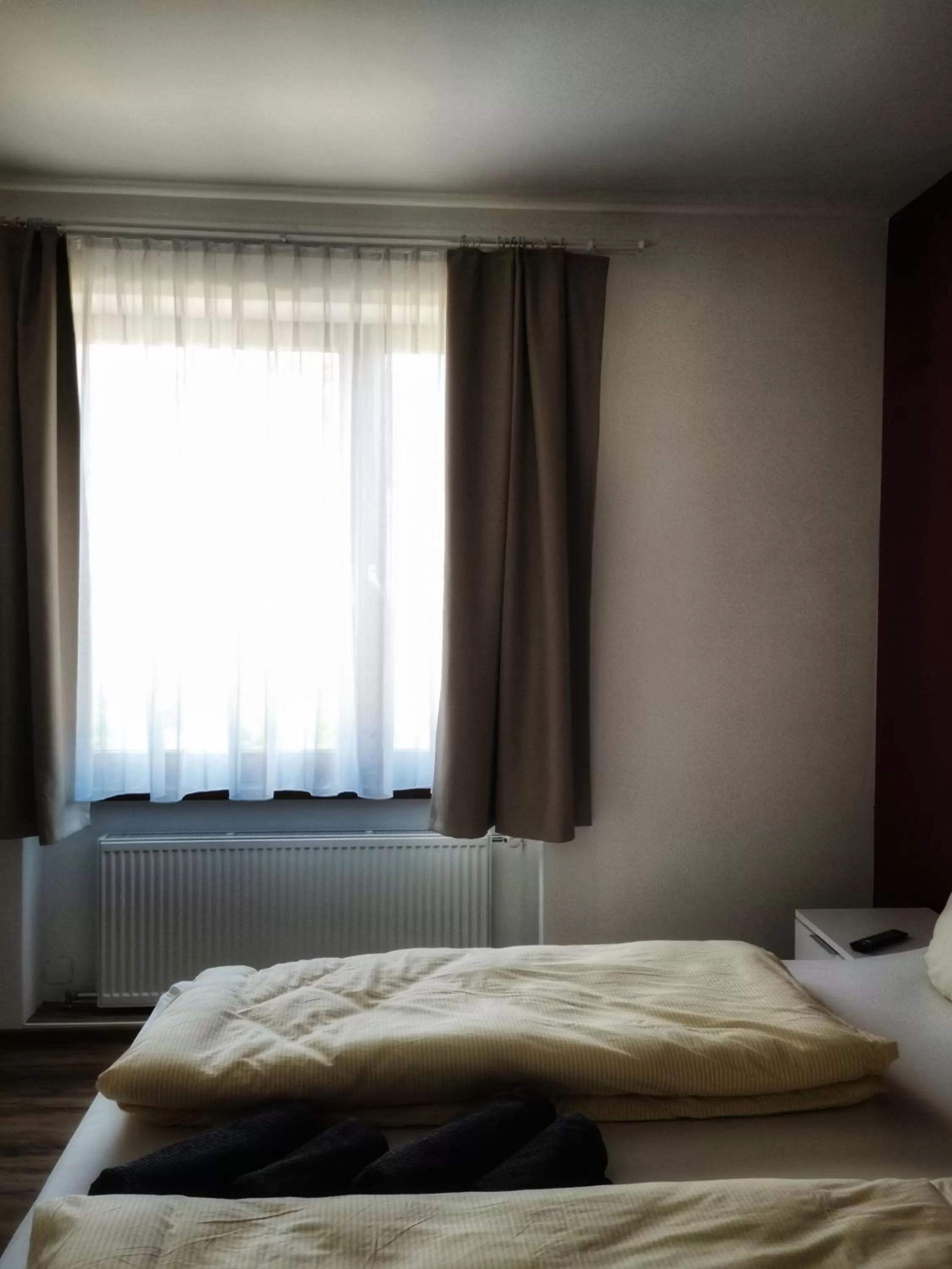 Bed in Hotel Grüner Baum - Melissone Italian Restaurant