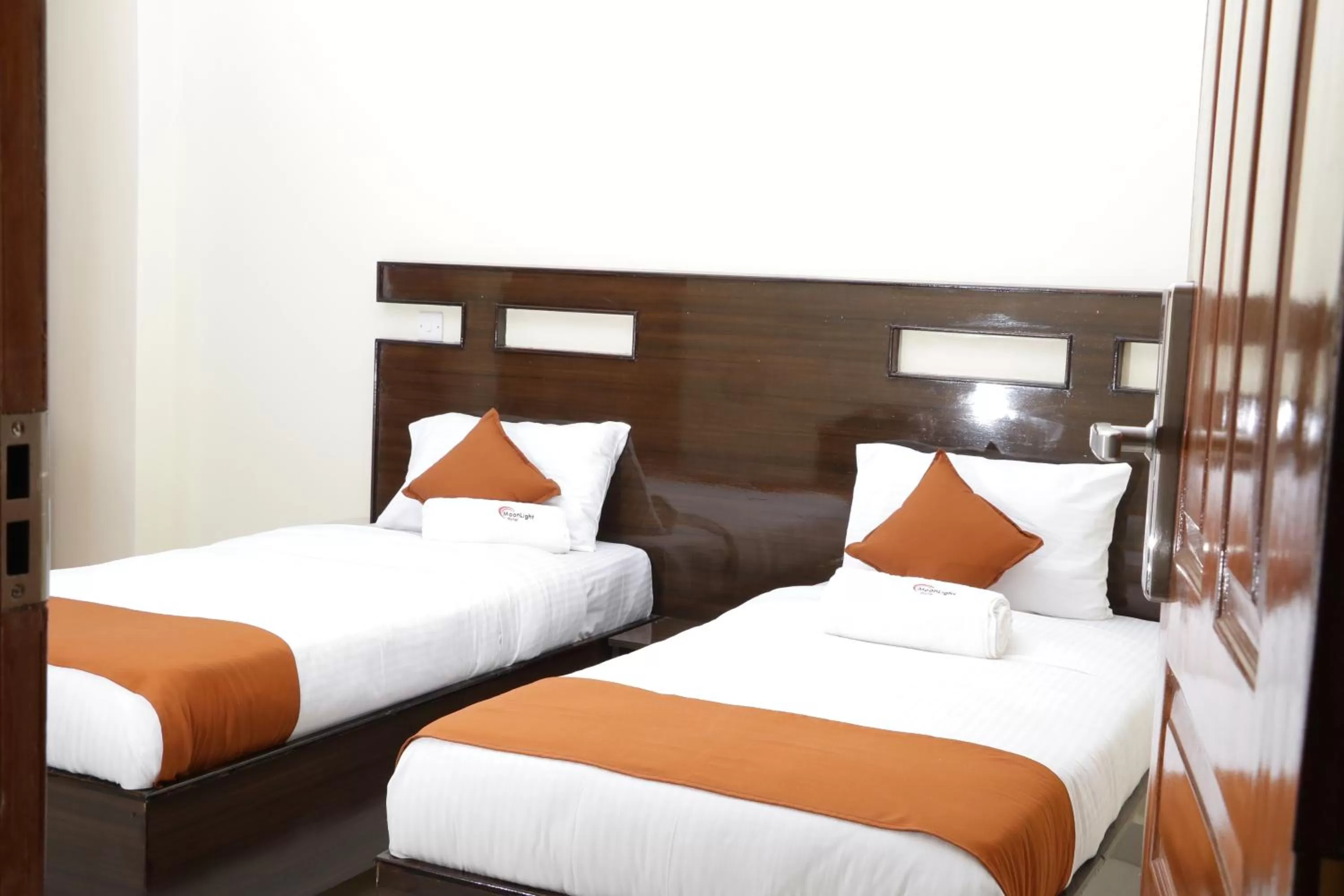 Bed in Claire de Lune Moonlight Hotel