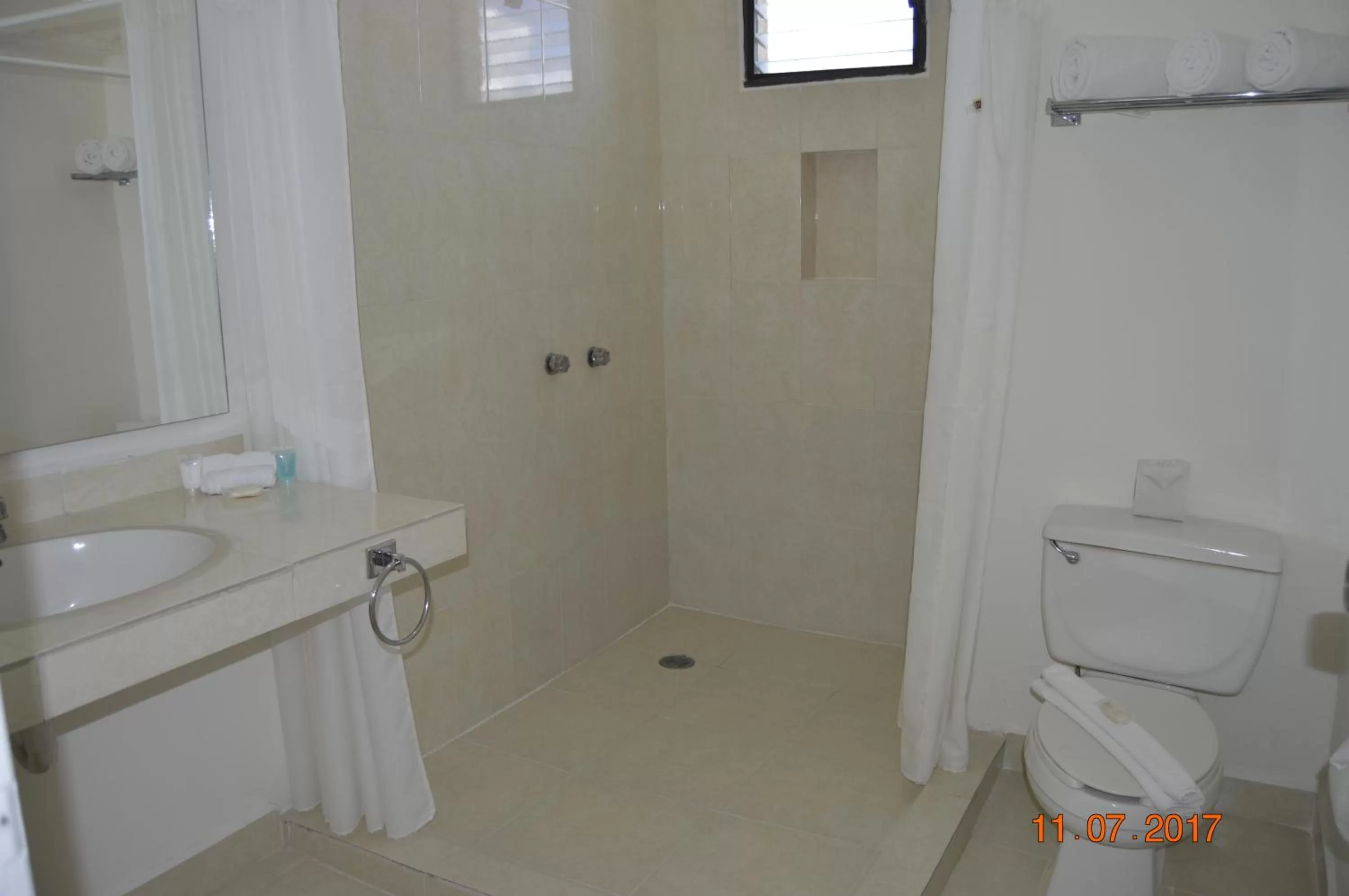 Bathroom in All Ritmo Cancun Resort & Water Park