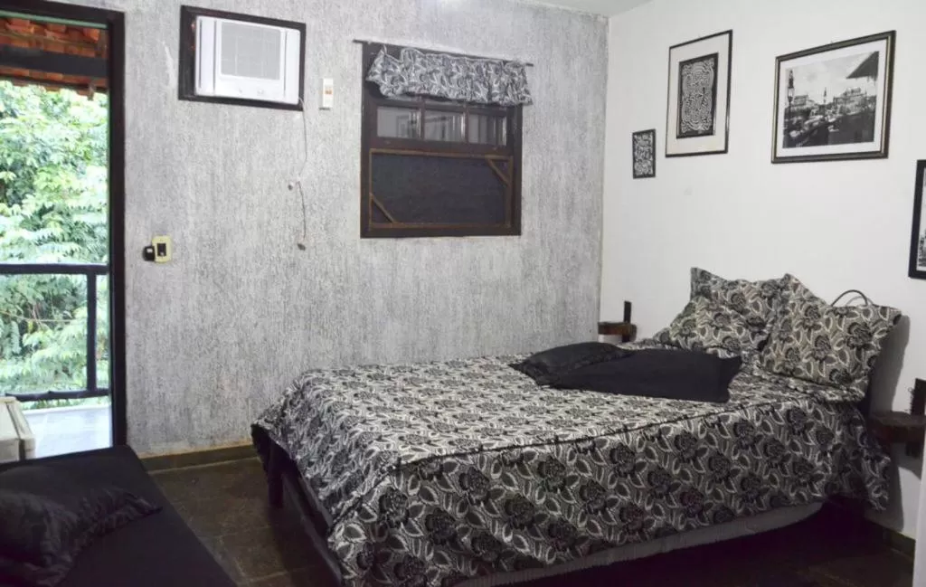 Bed in Pousada A Marca do Faraó