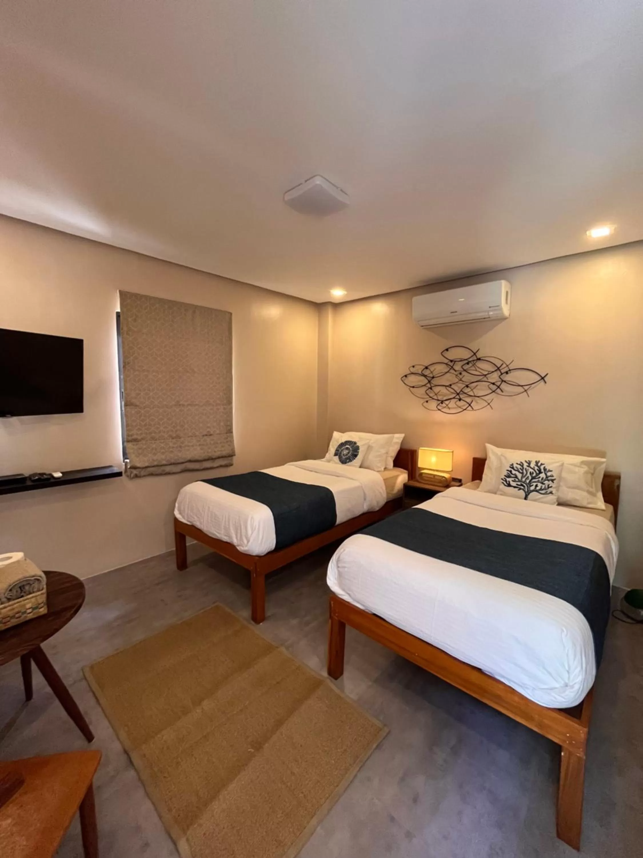 Bed in Southseas Beach Resort and Dive Center