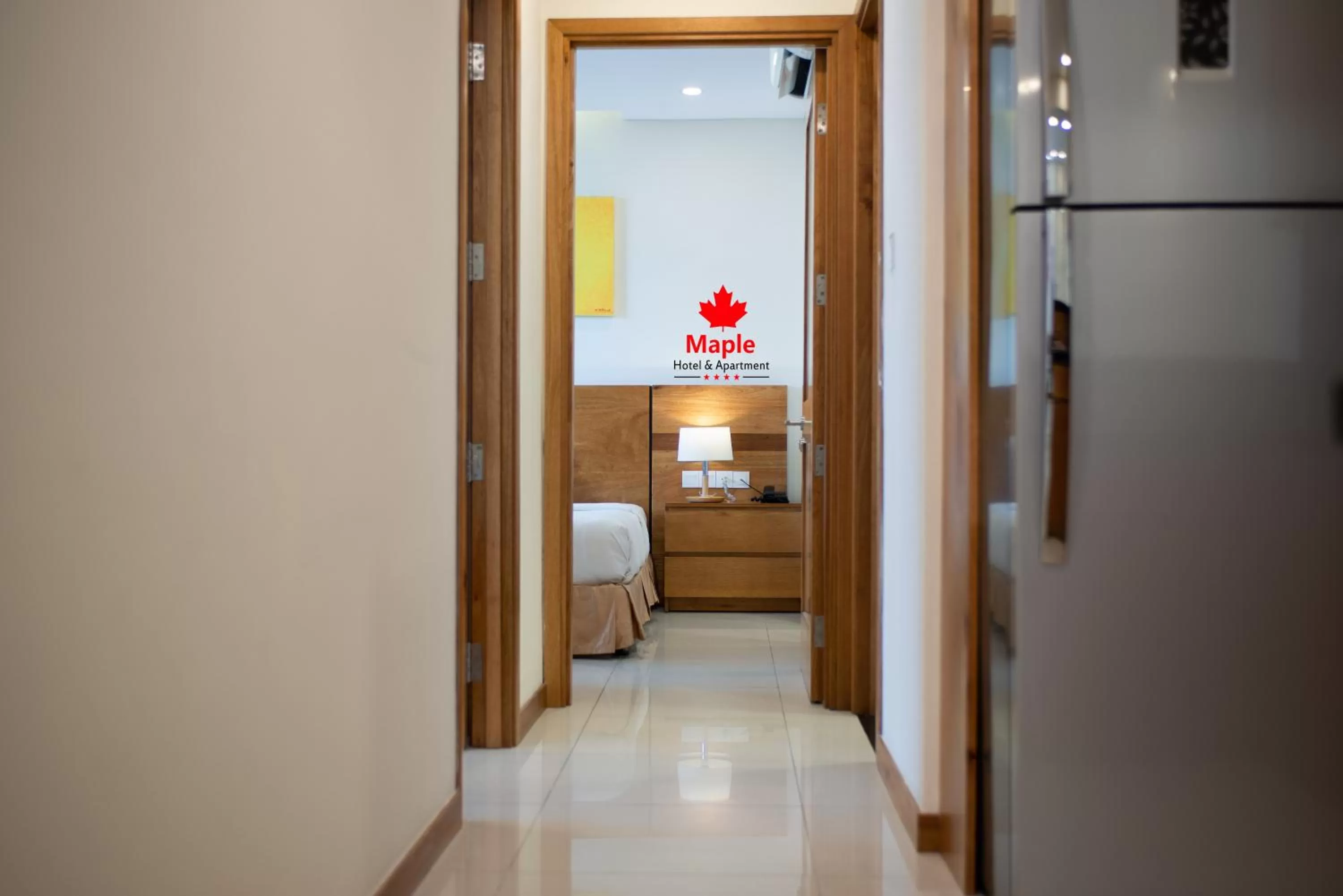 Bedroom in Maple Hotel & Apartment