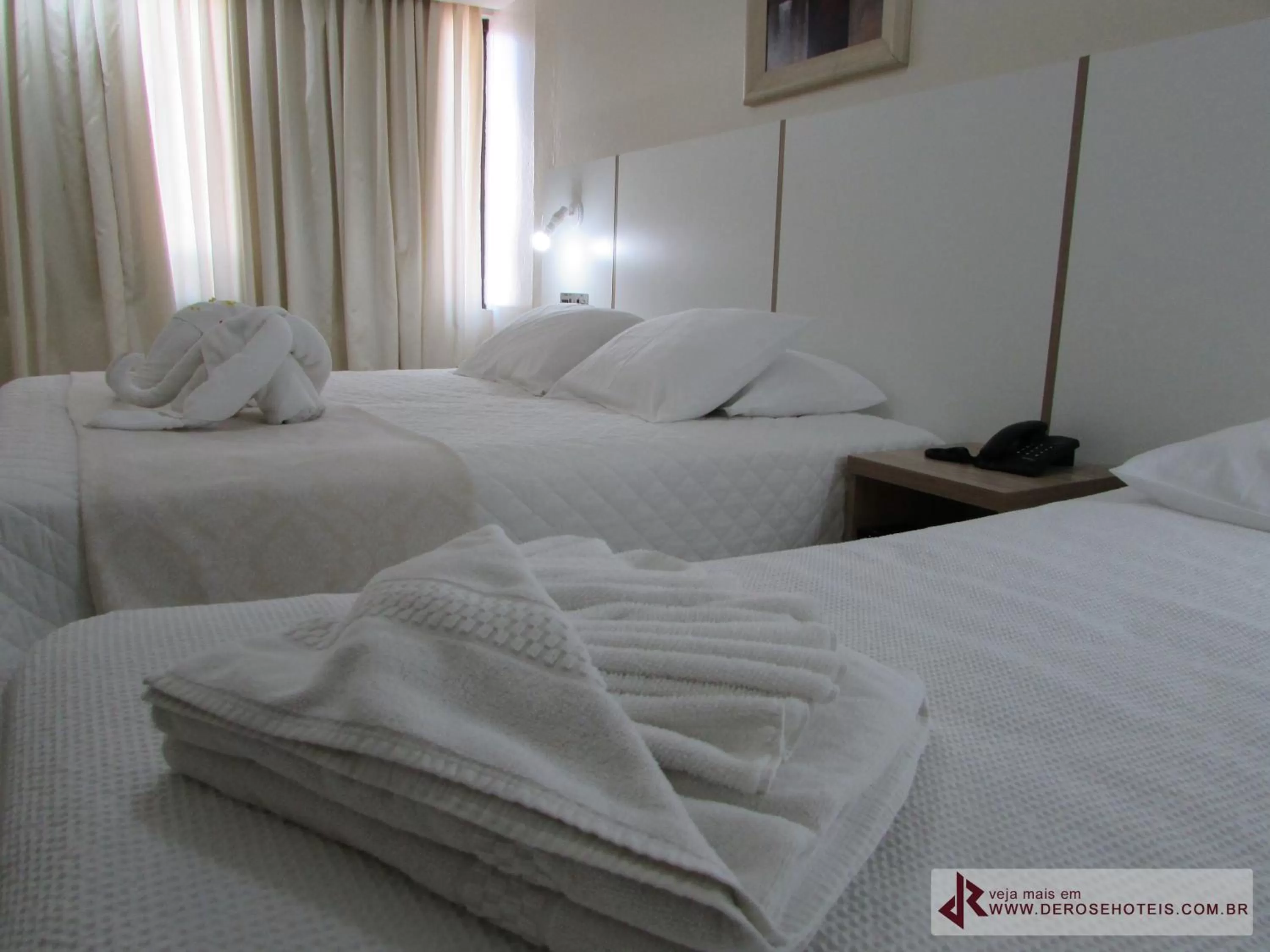 Bed in De Rose Palace Hotel