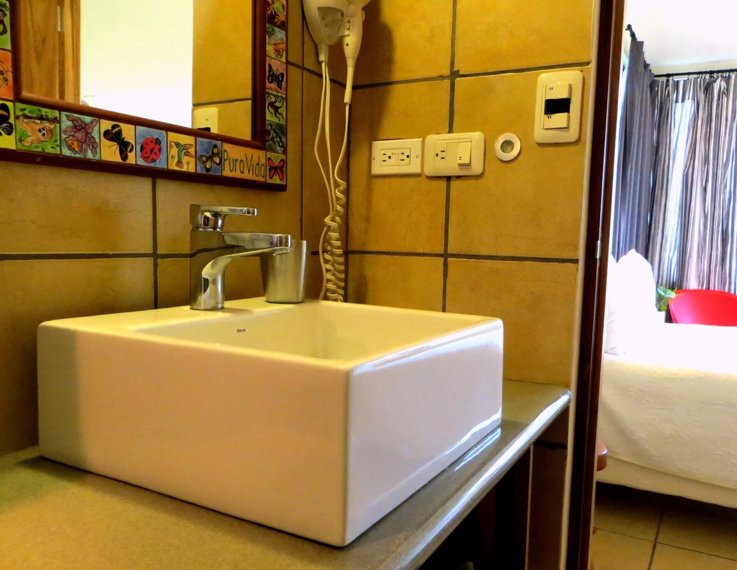 Bathroom, Bed in Pura Vida Hotel