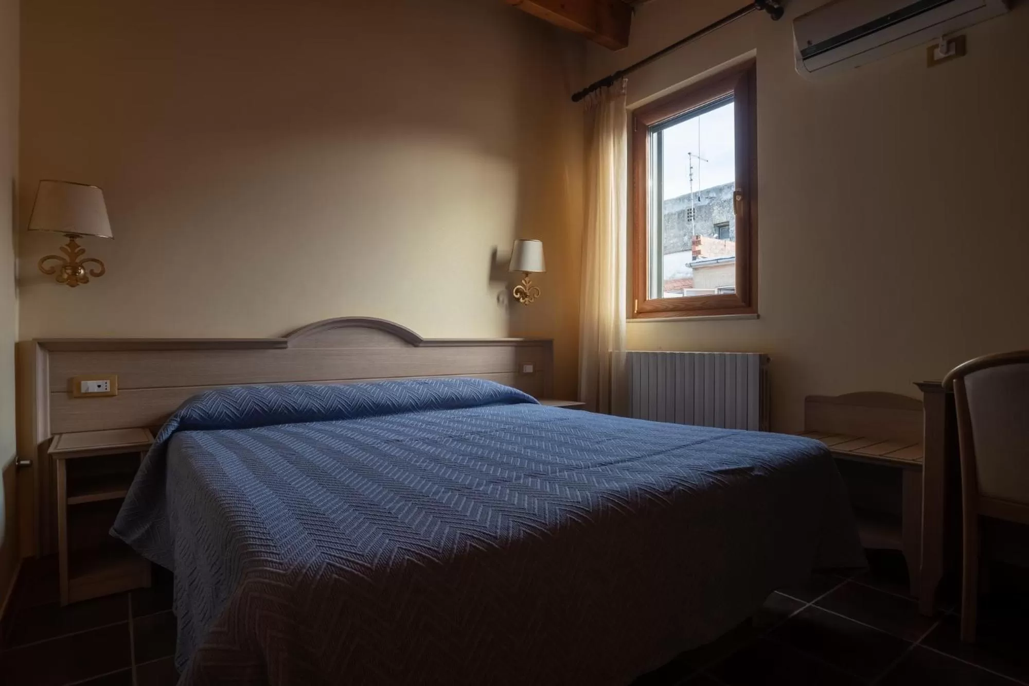 Bed in Hotel Don Giovanni