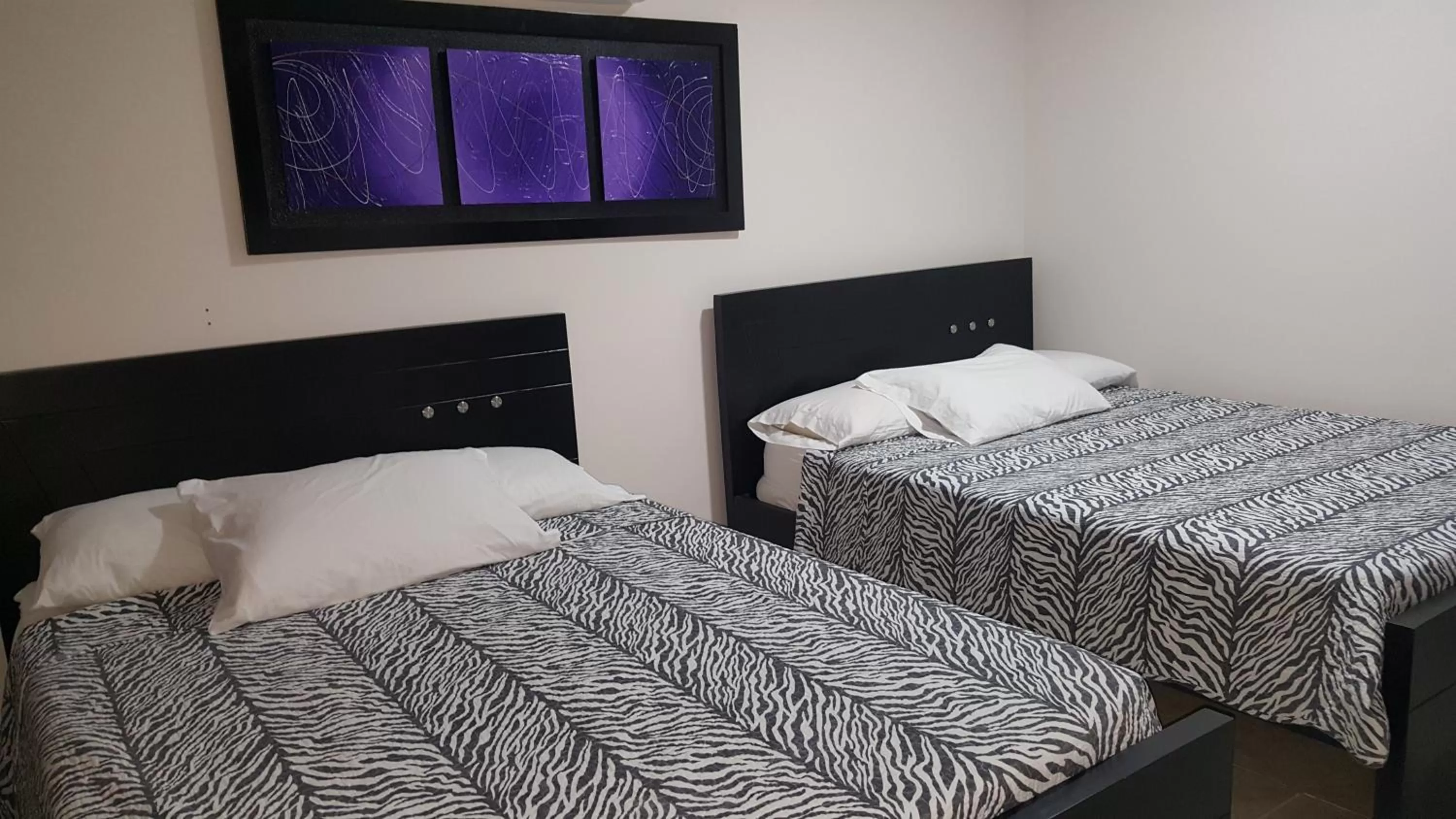 Bed in Caribbean Island Hotel Piso 2