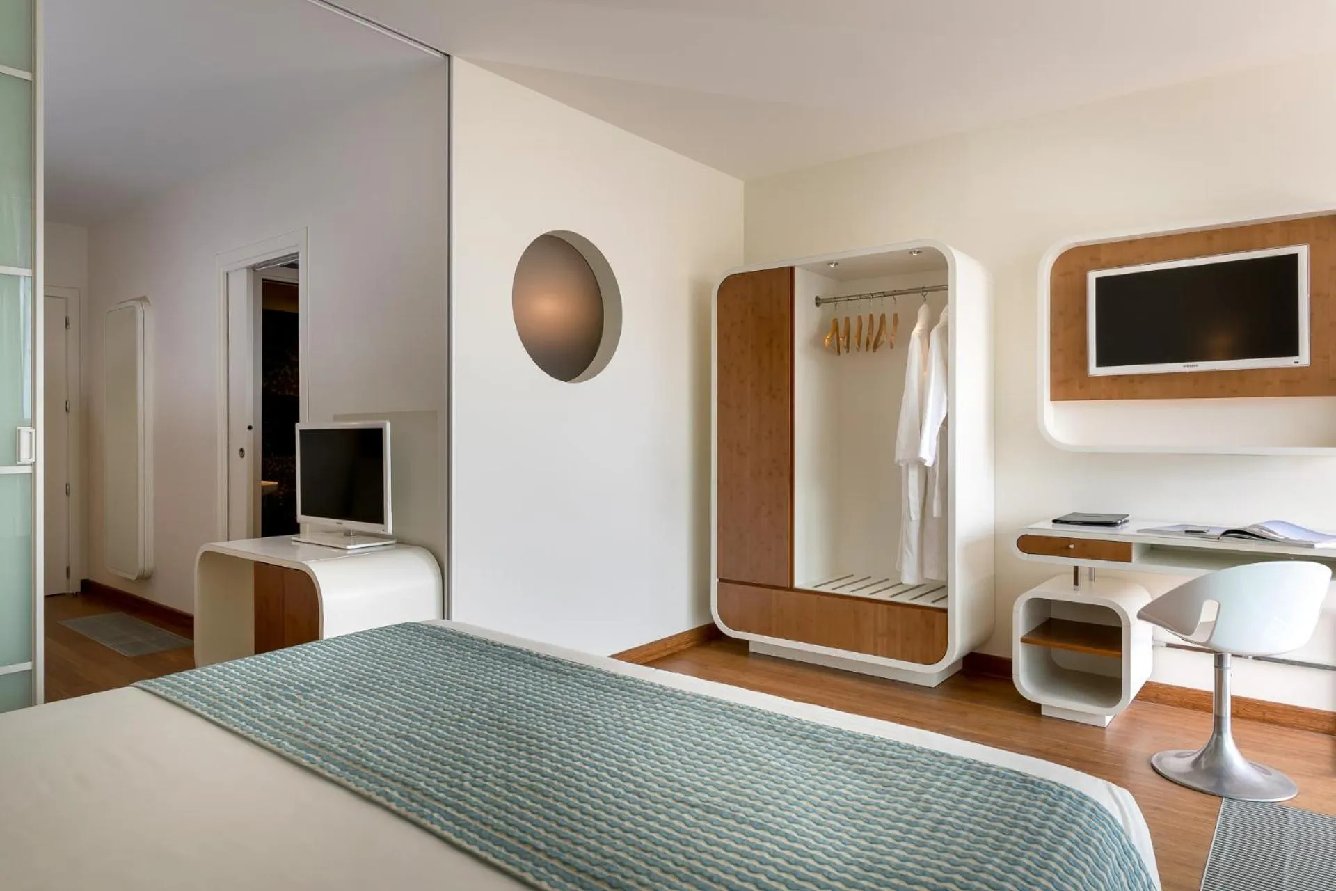 Bed in T-Suite Hotel