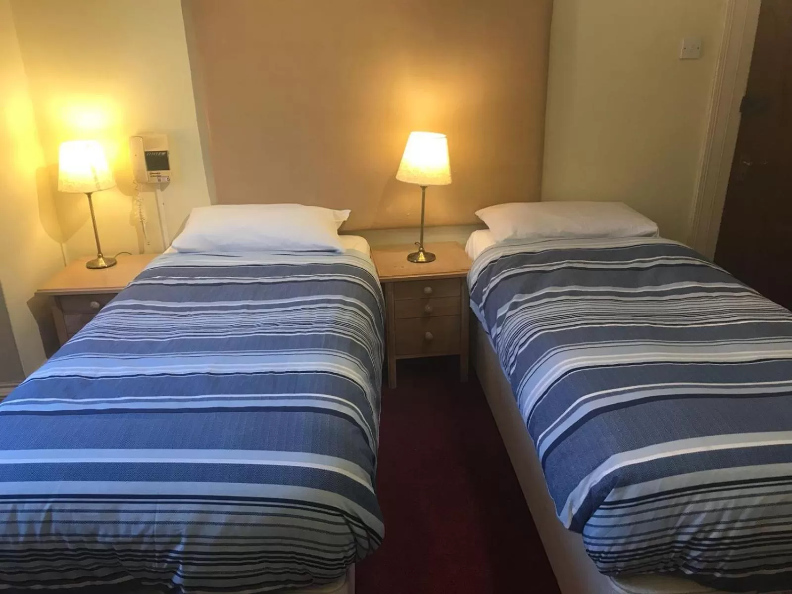 Bed in Ambassador Hotel