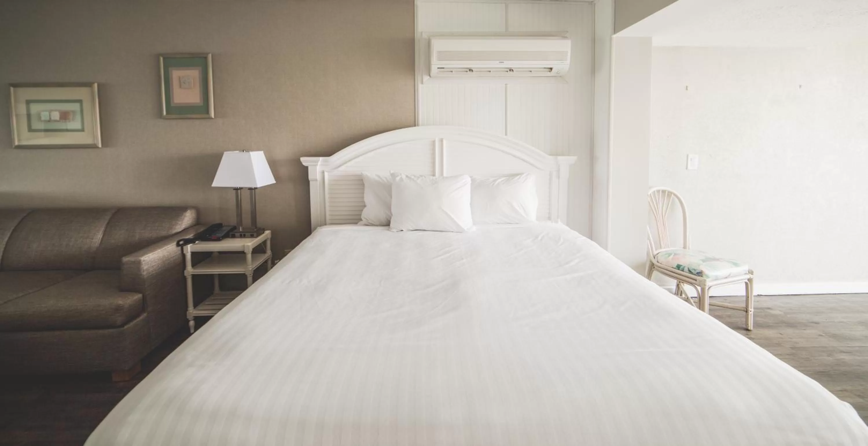 Bed in Surf Club Oceanfront Hotel