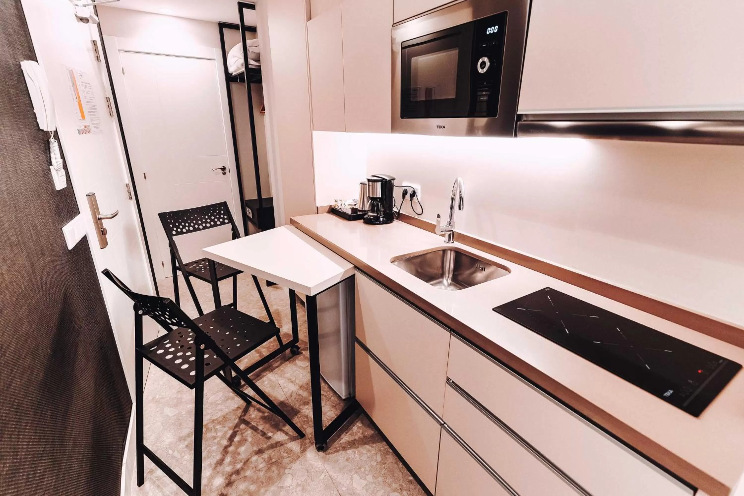 Kitchen or kitchenette in Posidonia Aparthotel