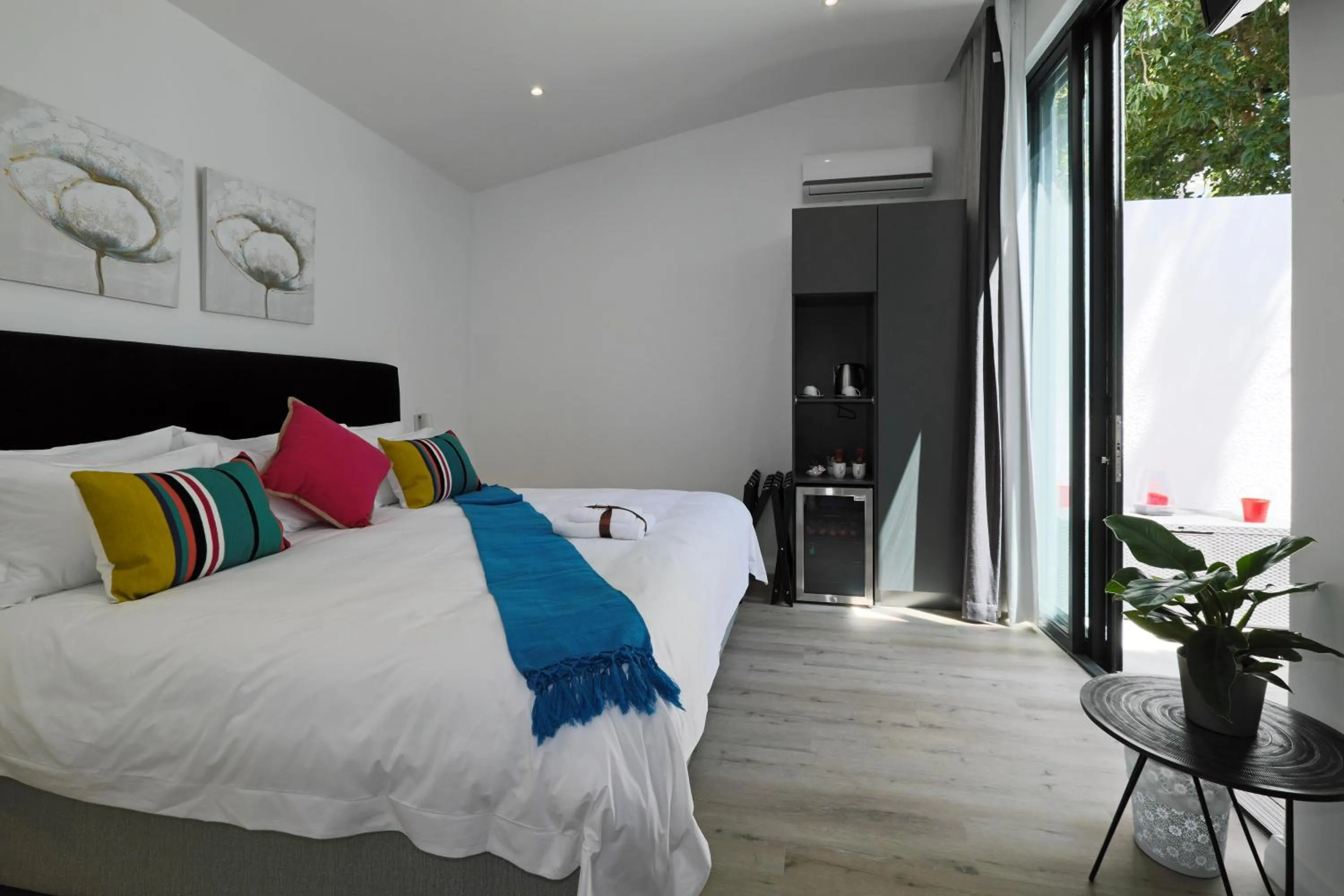 Bed in Point B Guest House -Sustainable Solar Energy