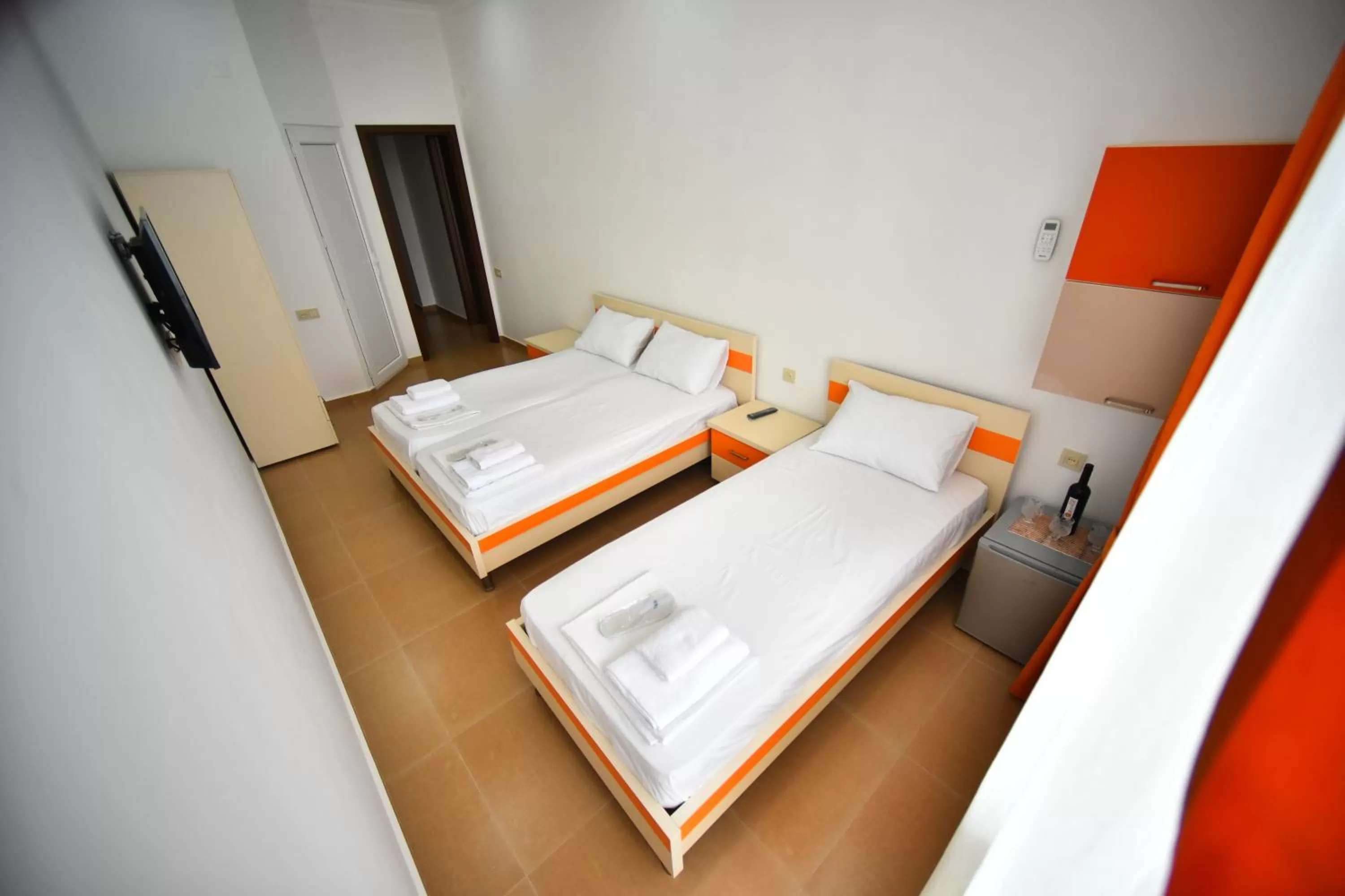 Bed in Orange Home Hotel