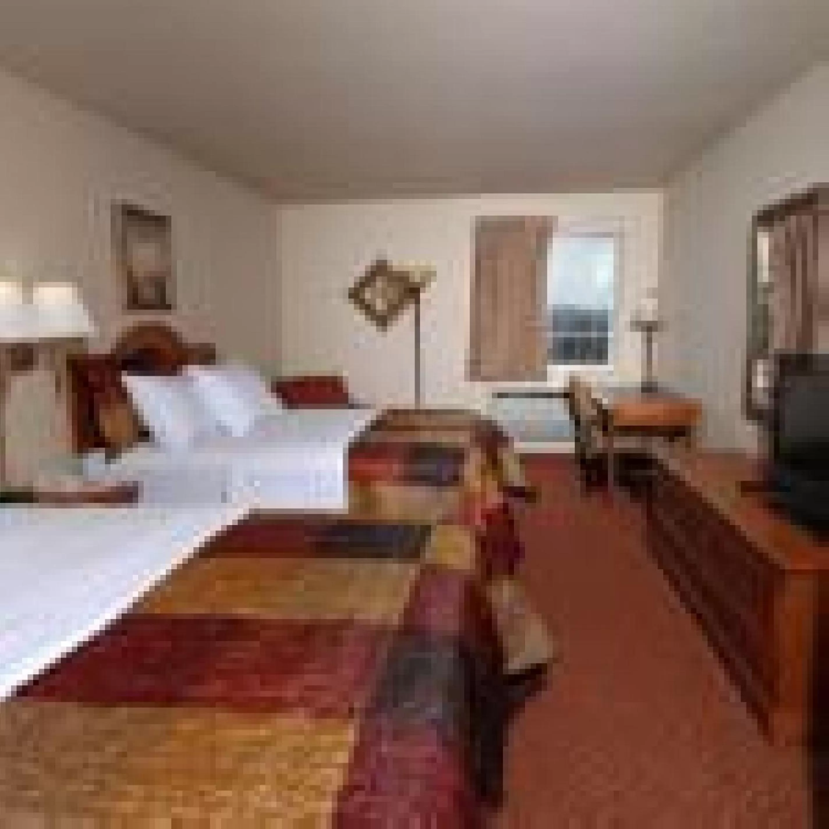 Bed in All American Inn & Suites Branson
