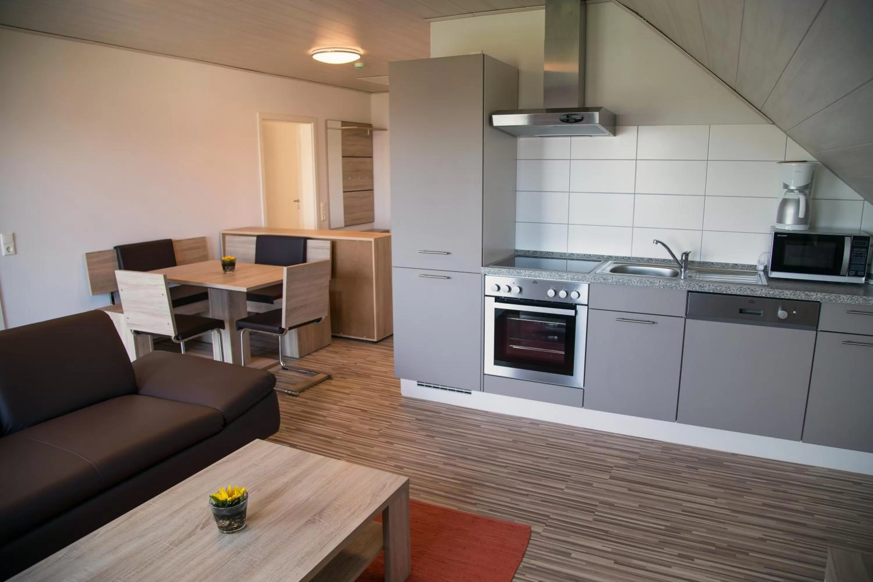 Kitchen or kitchenette in Gästehaus und Fewo Lamm Garni