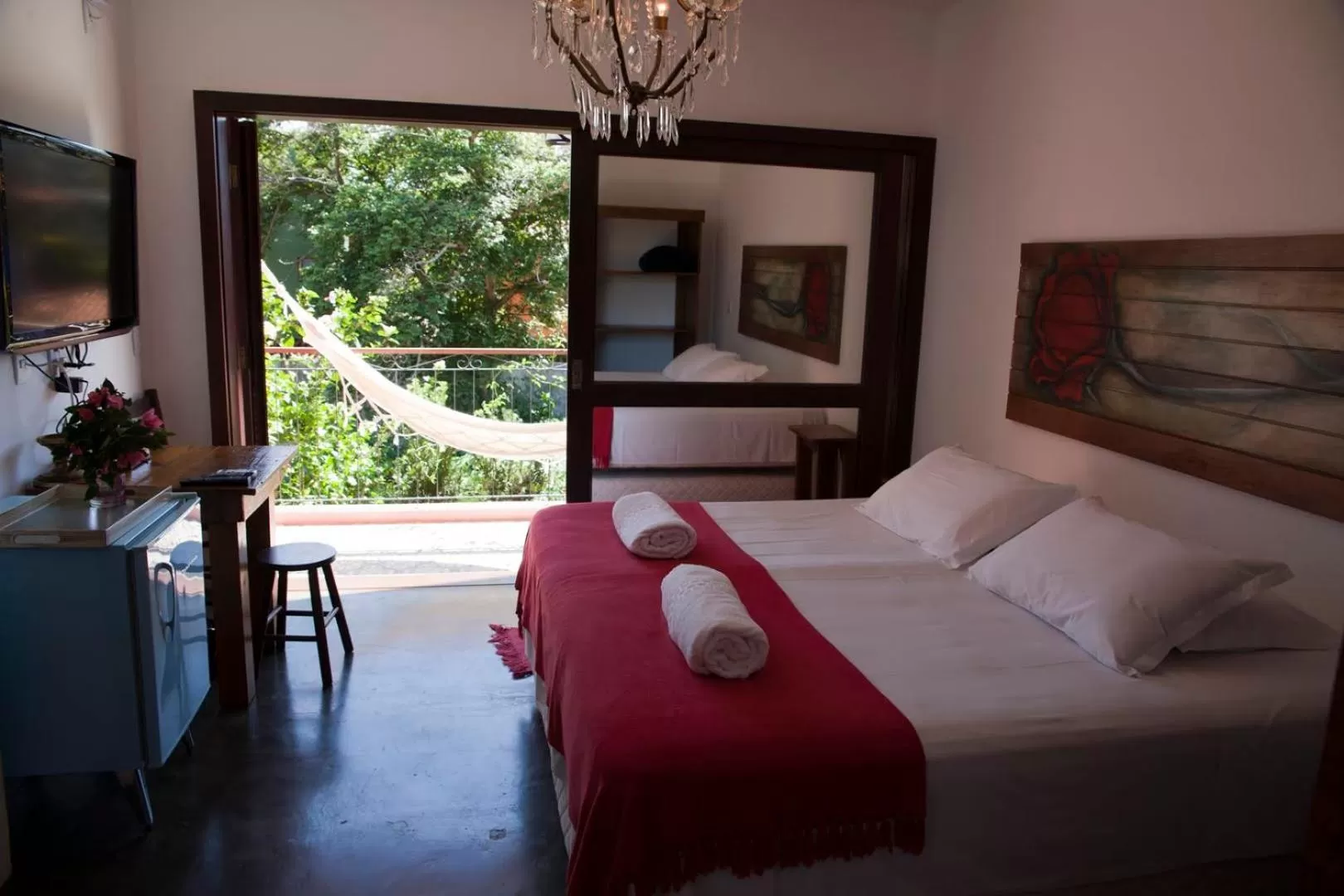 Balcony/Terrace, Bed in Pousada Vila Rosada