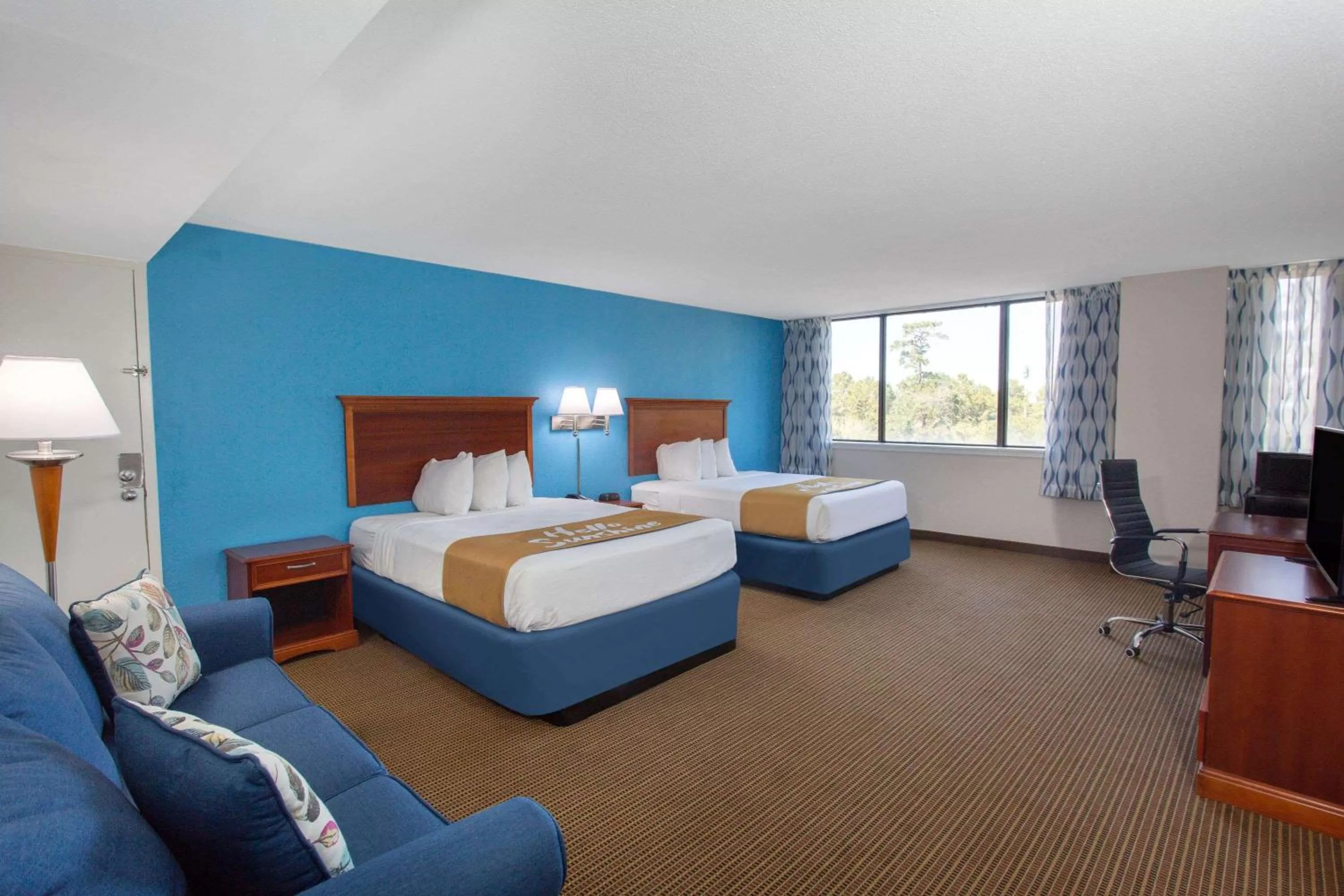 Photo of the whole room, Bed in Days Inn & Suites by Wyndham Tallahassee Conf Center I-10