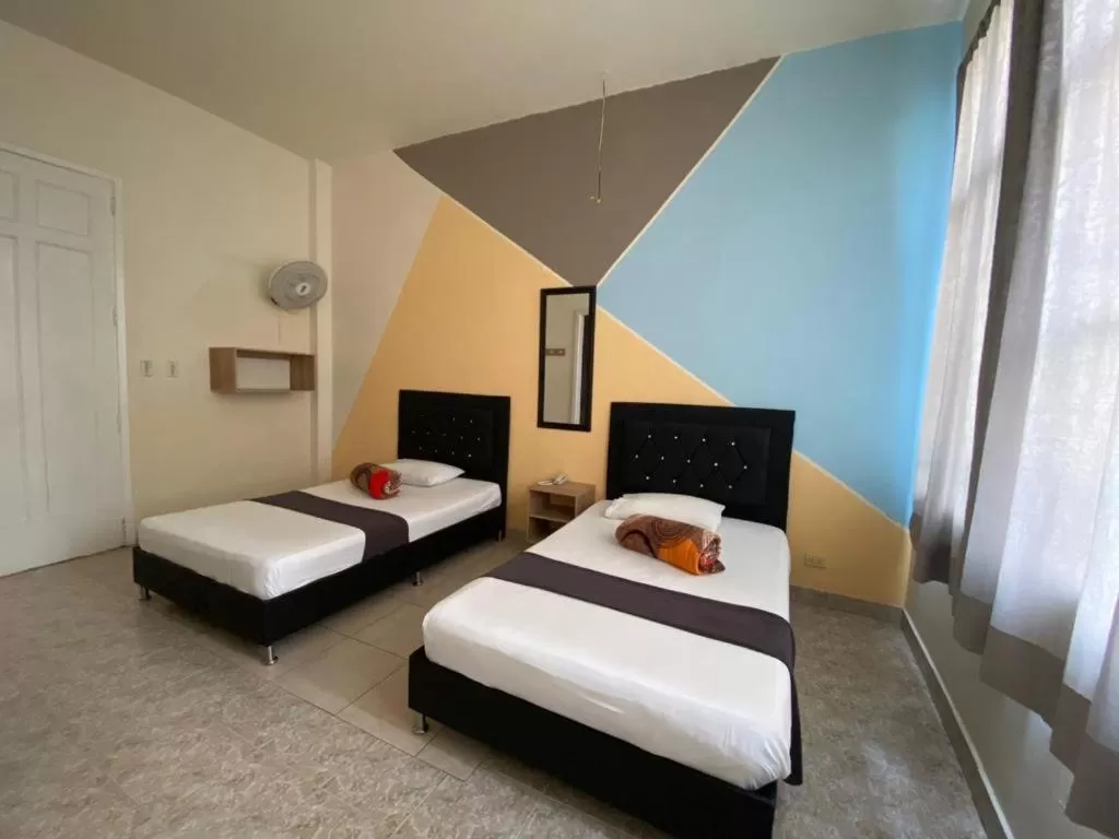 Bed in HOTEL CALLE REAL SUITE