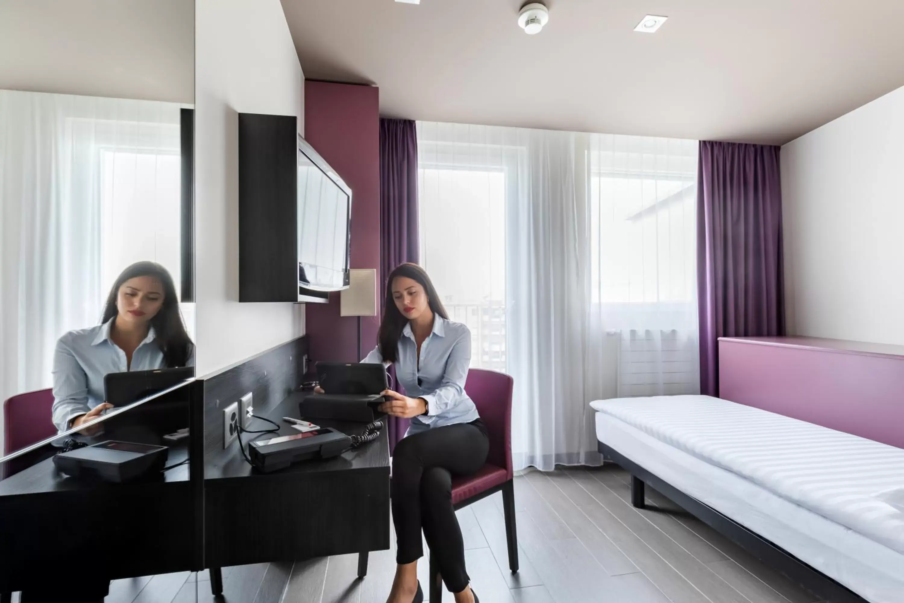 Single Room in Hôtel Les Nations Single Room in Hôtel Les Nations