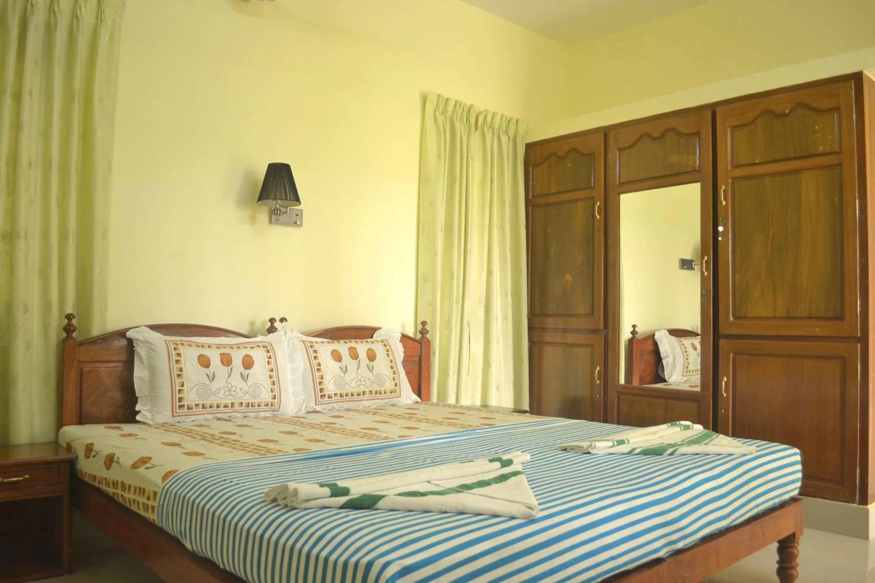 Bed in Ganesh Ayurveda Holiday Home