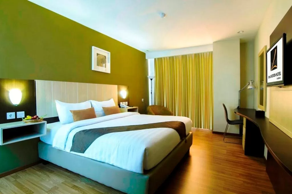 Bed in De Laxston Hotel Yogyakarta, Azana Hotels Collection