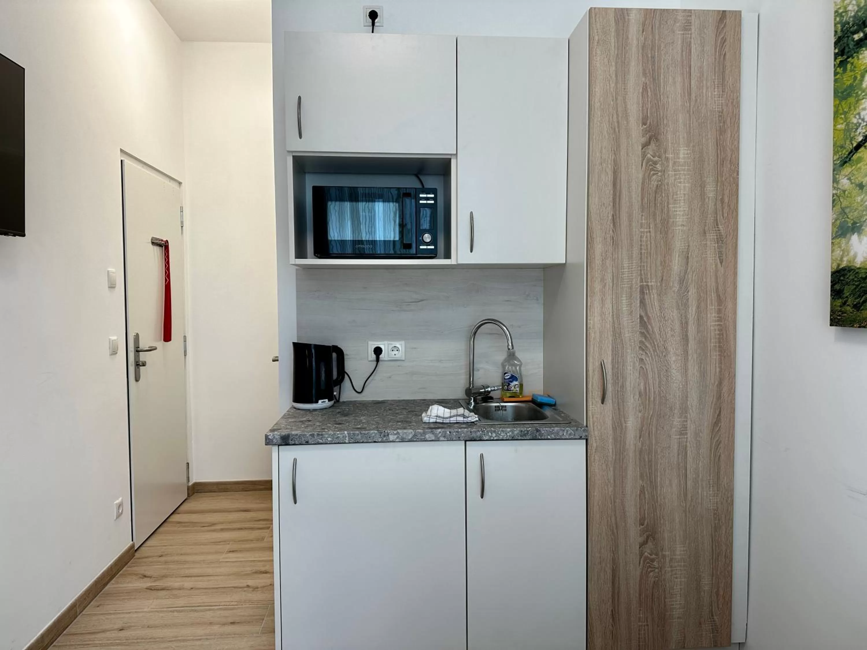 Kitchen or kitchenette in AJO Apartments - Messe City Flat - Self-Check-in