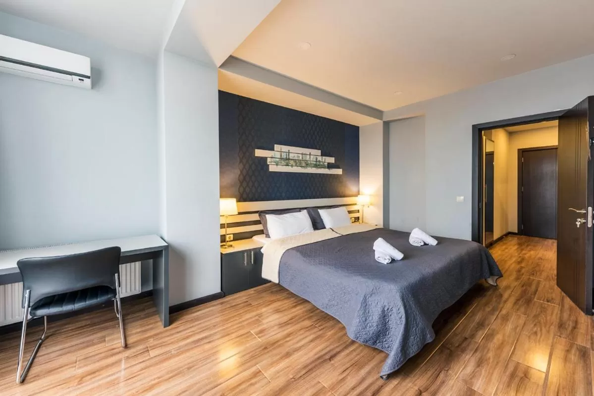 Bed in Sani Apart Hotel