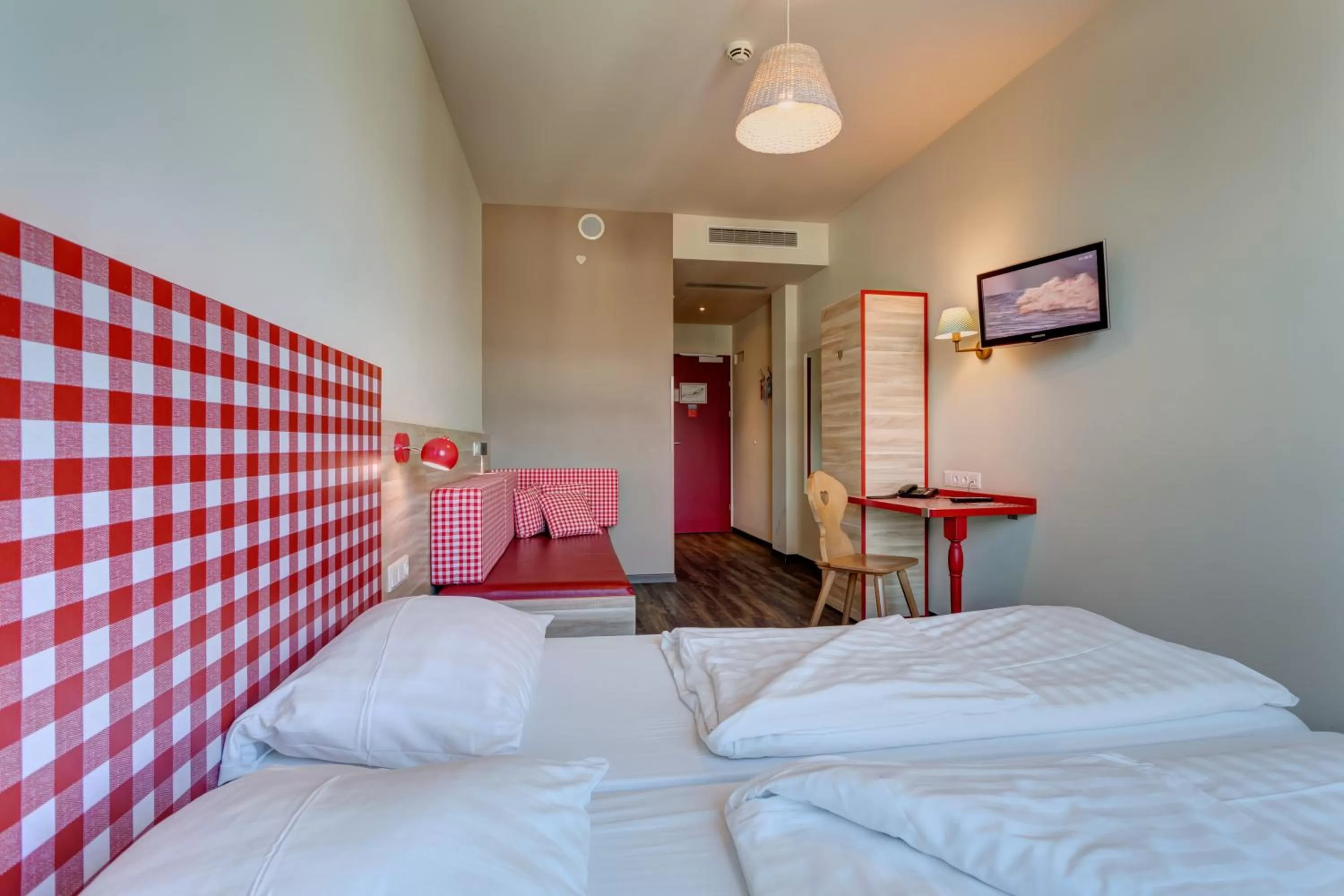 Photo of the whole room, Bed in MEININGER Hotel Salzburg City Center