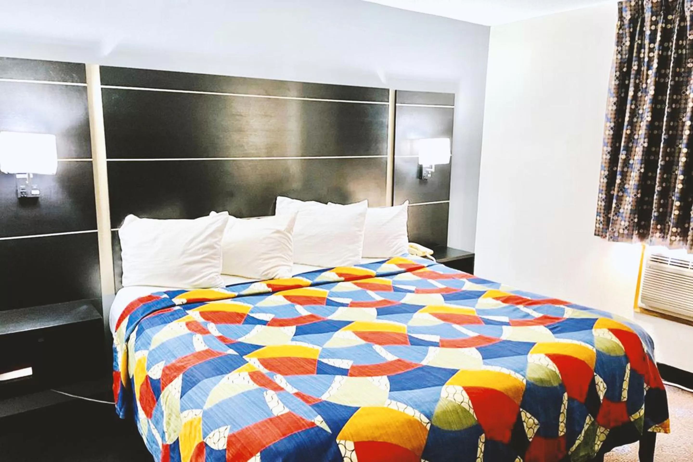 Bed in Coratel Inn & Suites by Jasper Northfield